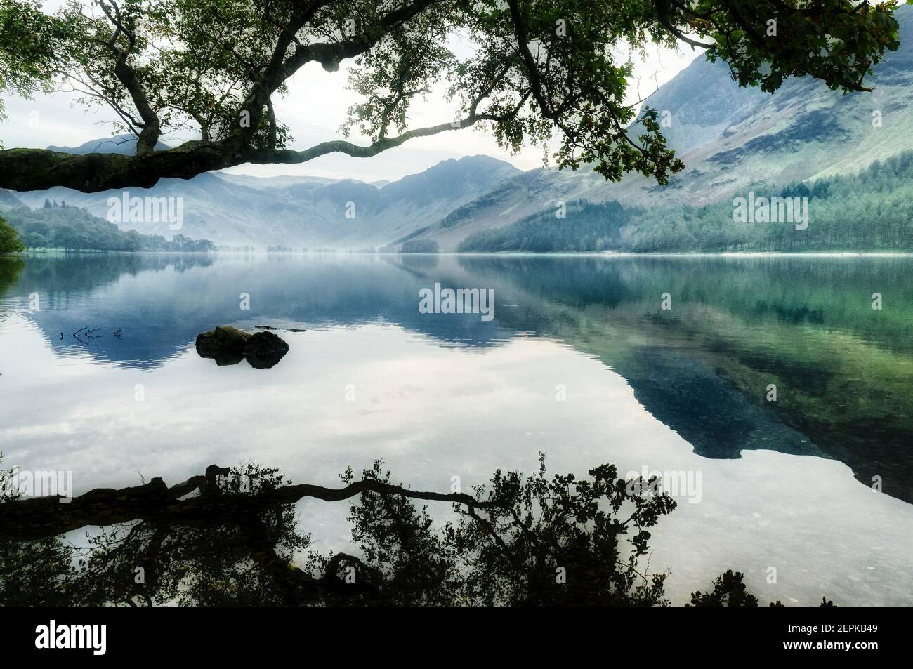 The Cumbrian mountains mirrored in Buttermere in The Lake District, Cumbria, UK Stock Photo