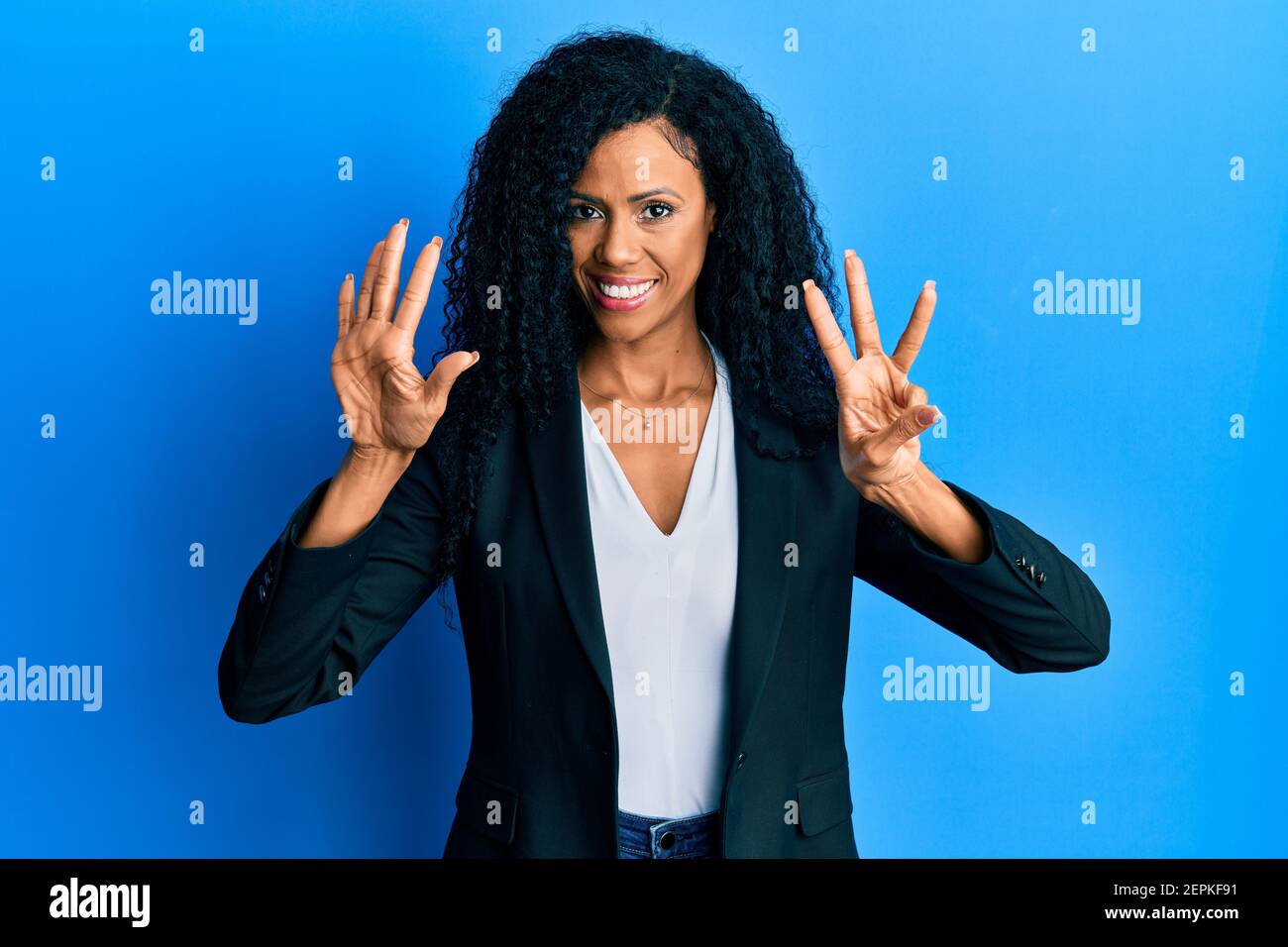 Middle age african american woman wearing business clothes showing and ...
