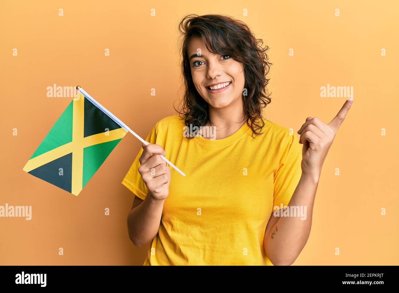 A pretty Jamaican woman in exercise outfit and on long black and