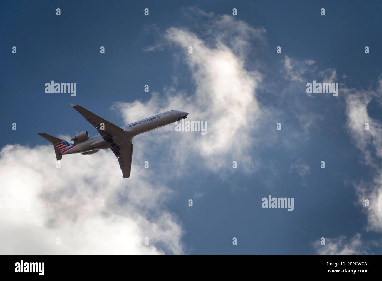 An American Eagle passenger jet (Bombardier CRJ701) operated by SkyWest Airlines approaches the