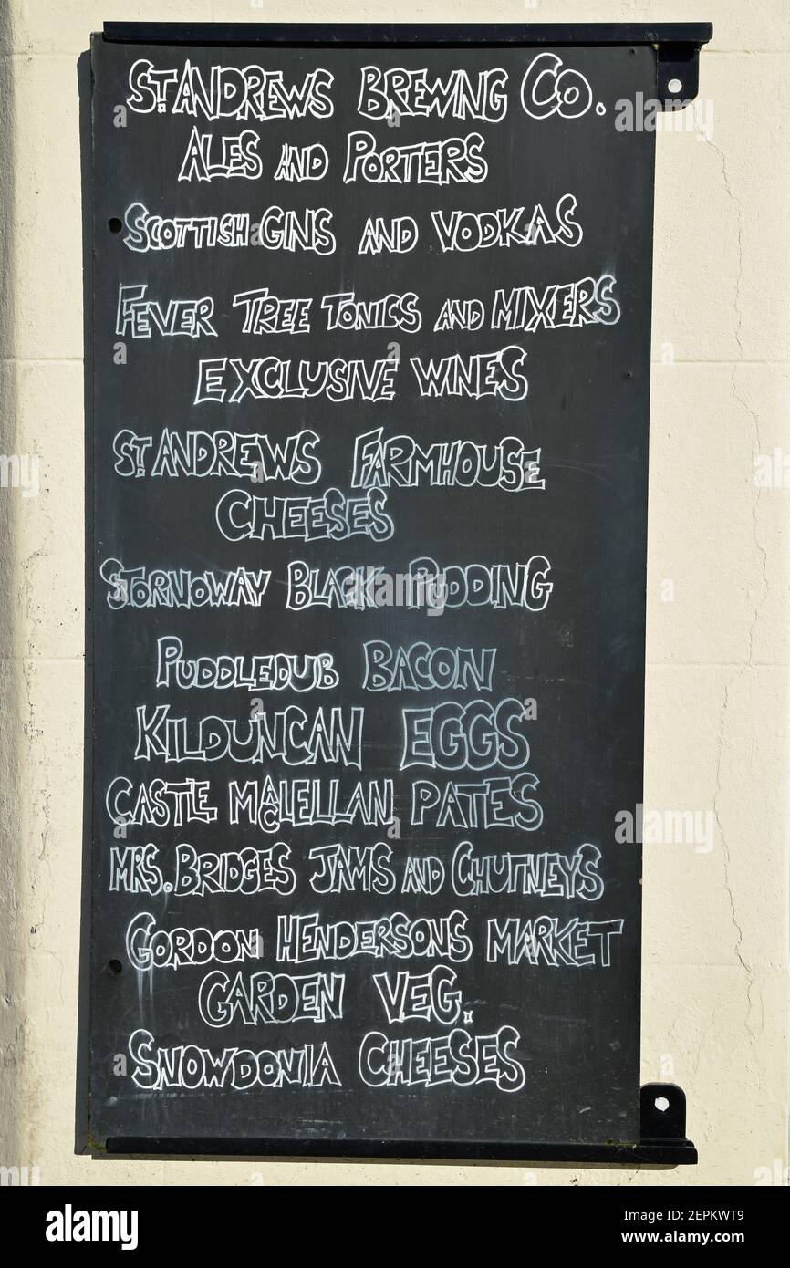 Blackboard outside shop in Crail, Fife, Scotland. Showing a list of local and traditional food and drink produce. Stock Photo