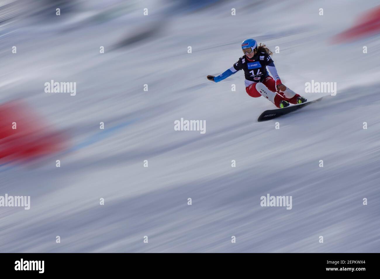 Snowboard Giant Slalom Competition.  Female competitor. Motion blur. Rogla ski resort, Slovenia. Stock Photo
