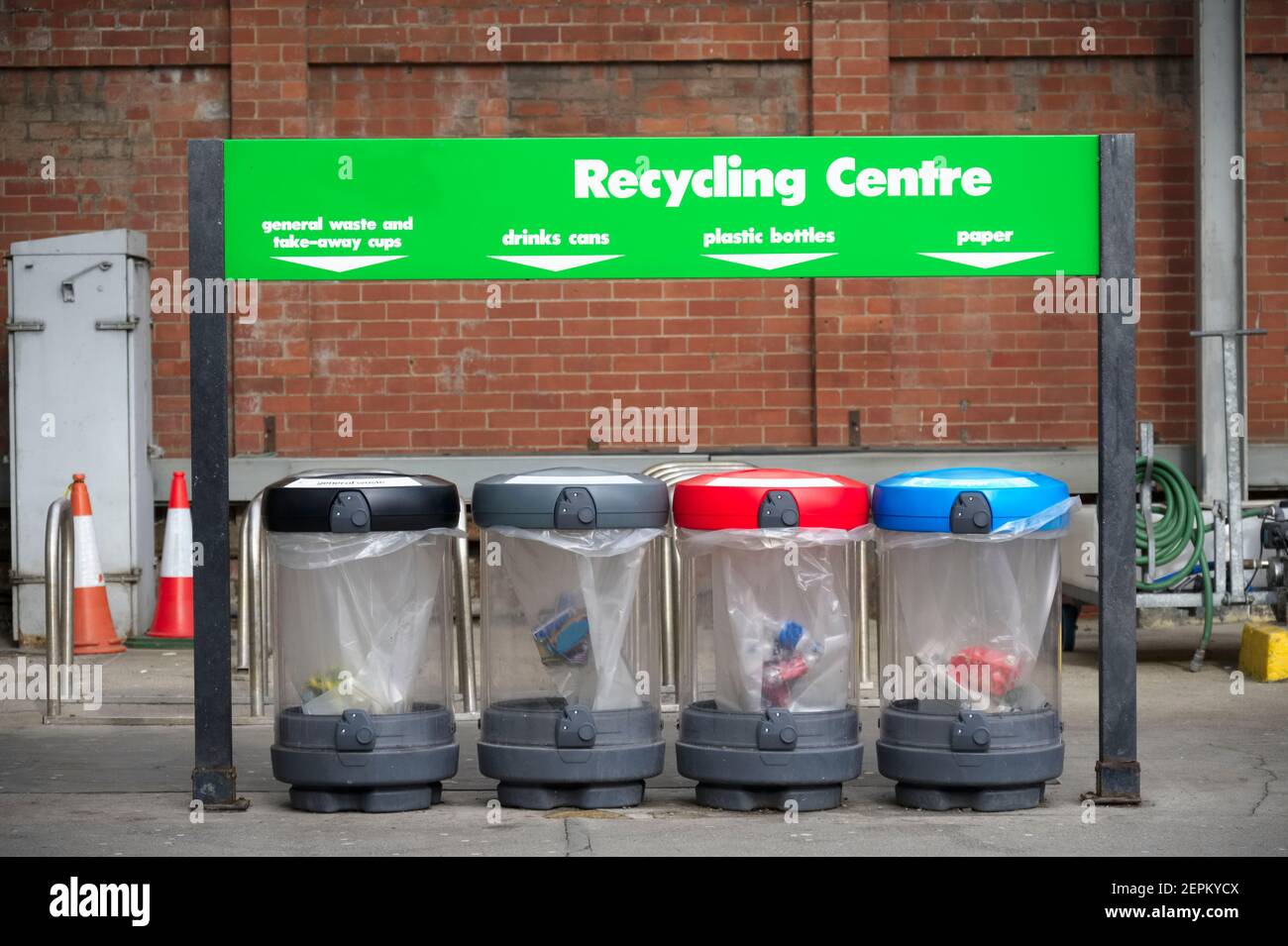 Recycling centre bin bags colour coded for plastic paper glass and