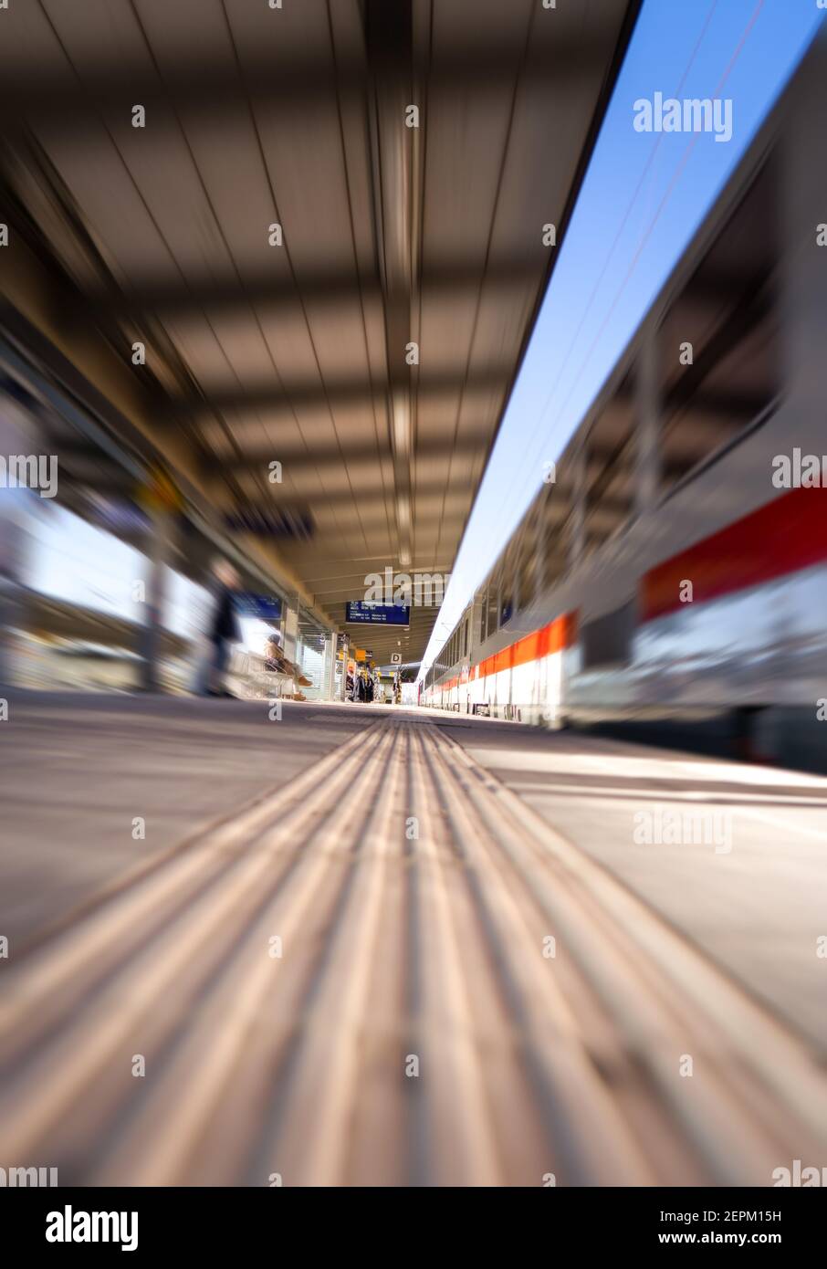 Fast moving train at station. Motion blur Stock Photo - Alamy