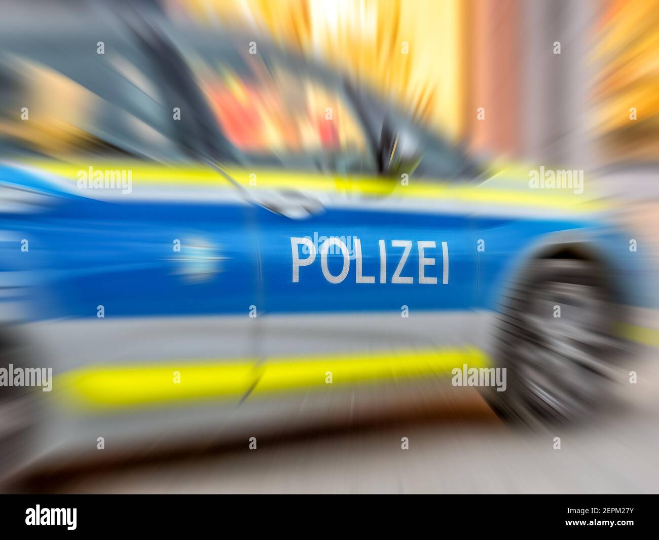 Motion blur of German police car with letters POLIZEI Stock Photo