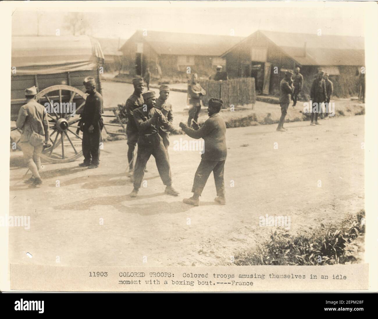 WW1 WWI Official United States military photograph of black combat soldiers serving in France. Caption ' Colored troops amusing themselves in an idle moment with a boxing bout ' Stock Photo