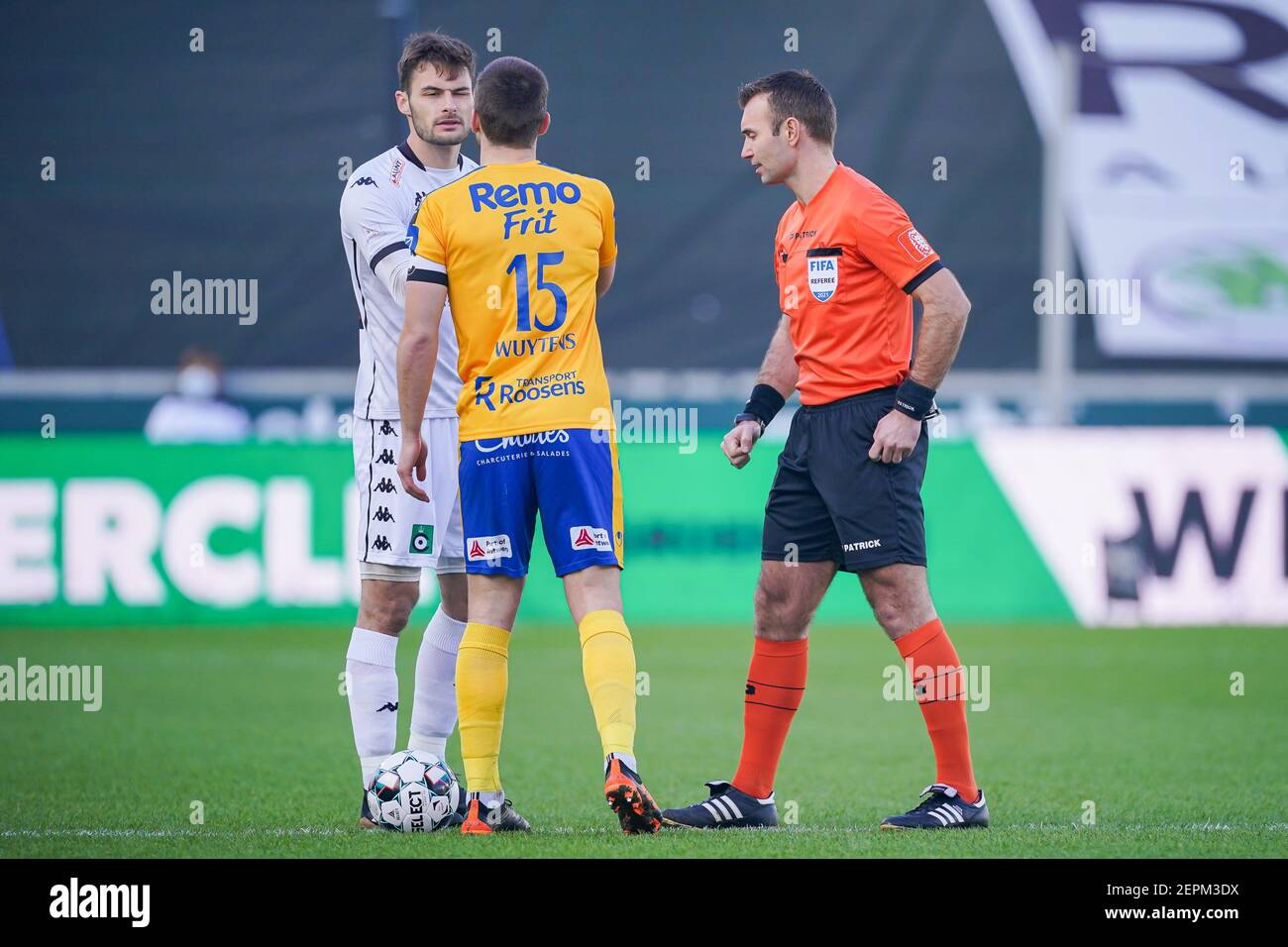 BRUGES, BELGIUM - FEBRUARY 27: Goalkeeper Thomas Didillon of Cercle Brugge, Dries Wuytens (c) of Waasland Beveren, Referee Nicolas Laforge during the Stock Photo