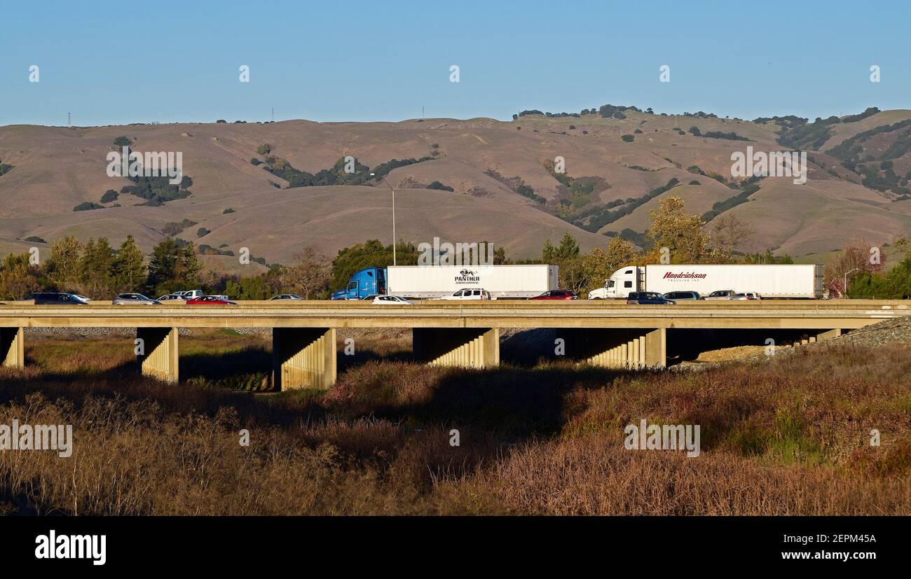 trucks and autos on 880 overpass over Alameda Creek, California Stock Photo