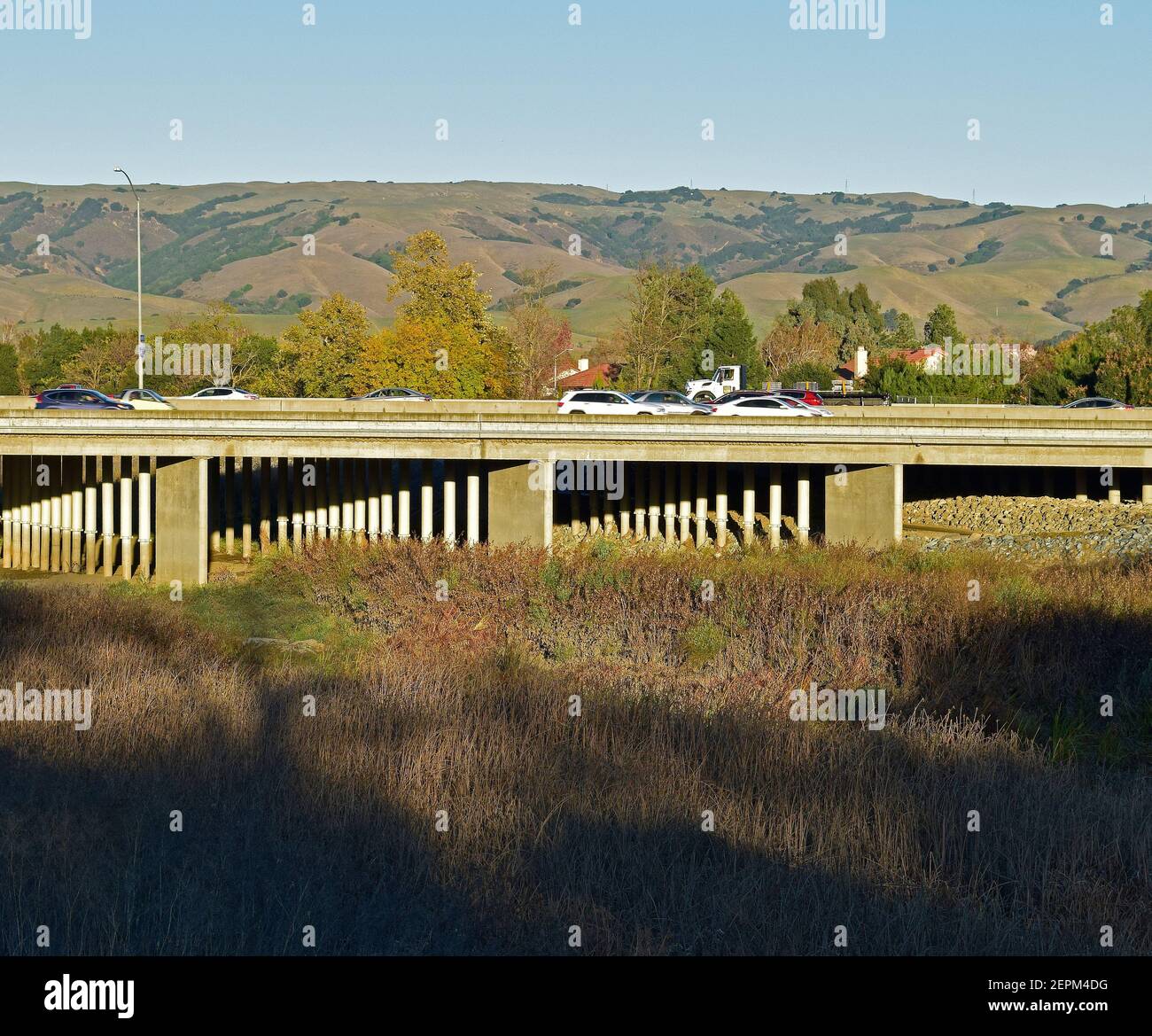 truck and autos on 880 overpass over Alameda Creek, California Stock Photo