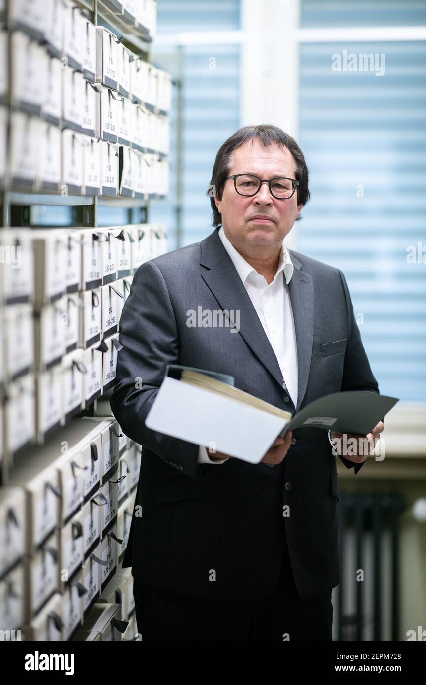 Ludwigsburg, Germany. 18th Feb, 2021. Senior Public Prosecutor Thomas Will, head of the Central Office of the State Justice Administrations for the Investigation of National Socialist Crimes, stands among the files used for the work of the Central Office at the branch office of the Federal Archives in Ludwigsburg. (to dpa: 'Coming to terms with Nazi crimes will be expanded to include Einsatzgruppen') Credit: Sebastian Gollnow/dpa/Alamy Live News Stock Photo