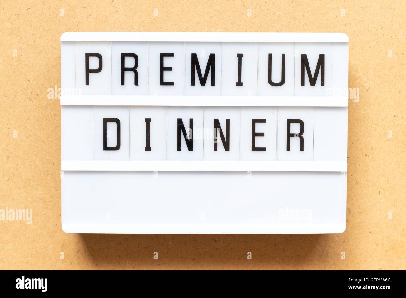 Lightbox with word premium dinner on wood background Stock Photo