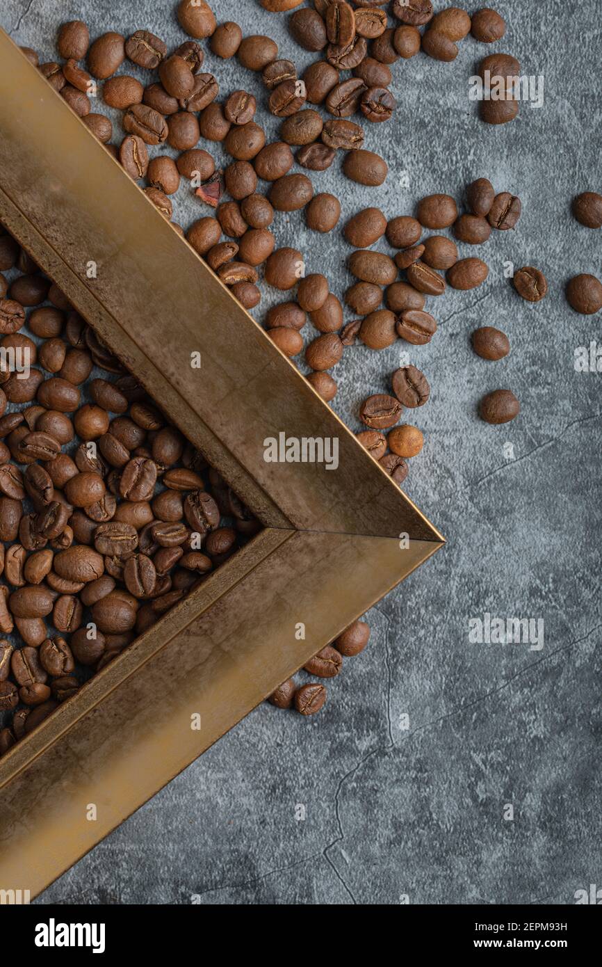 Coffee beans with empty frame on a marble background Stock Photo