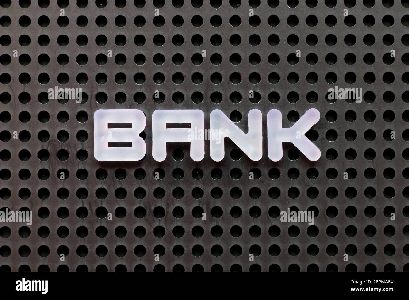 Word Bank Lettering White color letter in word bank on black pegboard background Stock ...