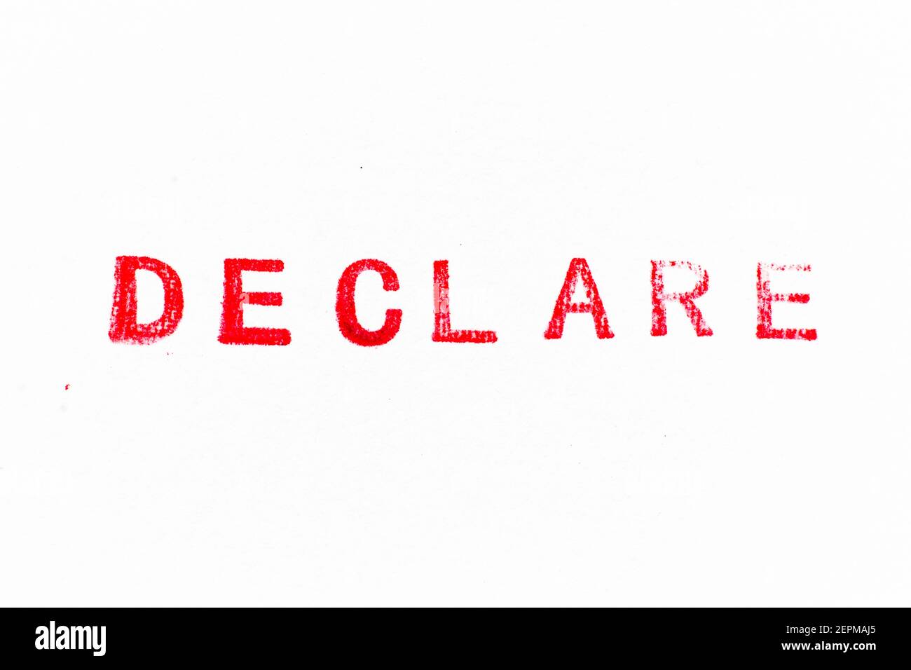 Word Declare Red color ink rubber stamp in word declare on white paper background ...