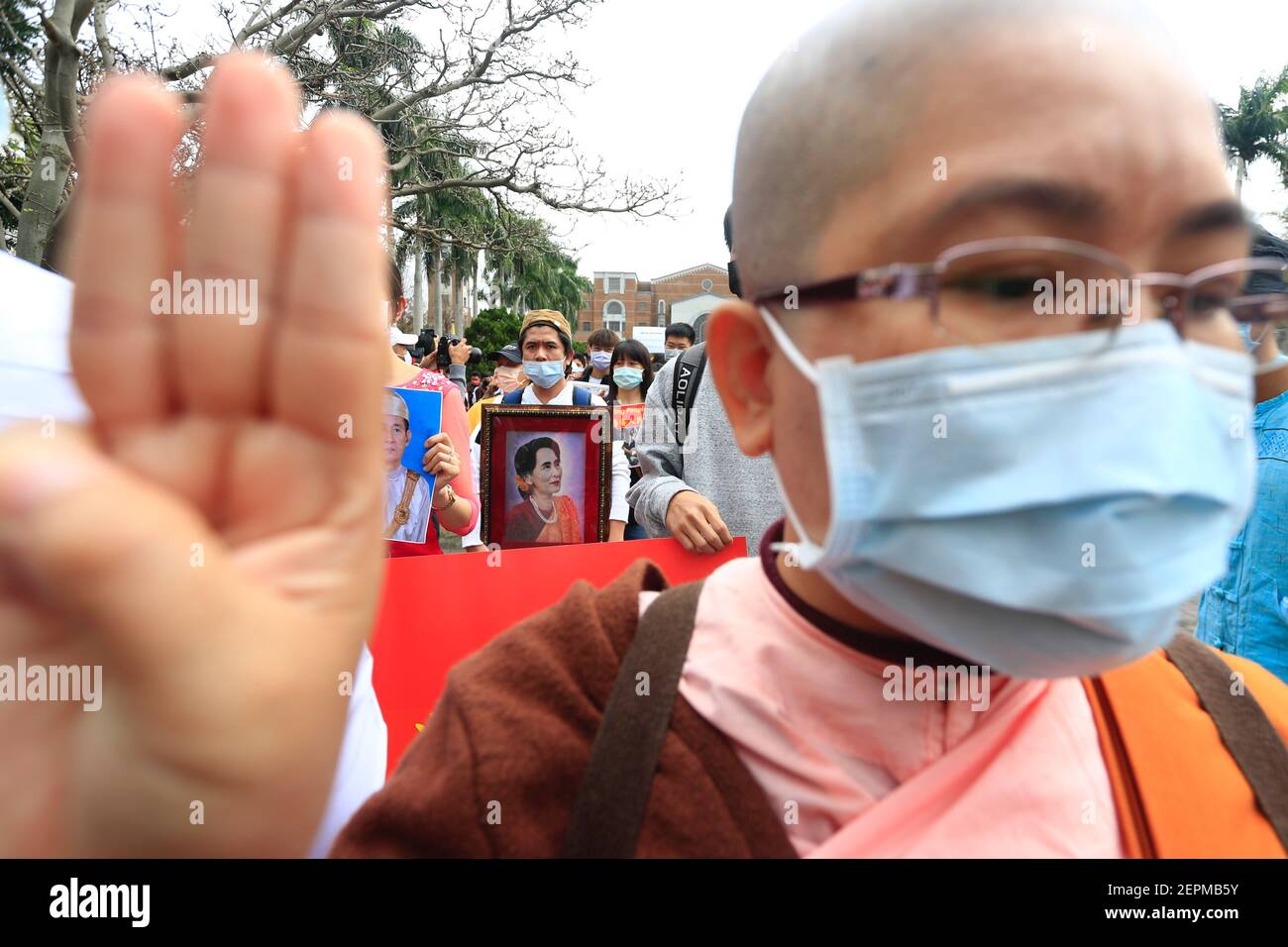 Taipei, Taipei, Taiwan. 28th Feb, 2021. Bernese supporters of the National League for Democracy flash a three fingers flash during a march to protest against the ongoing military coup in Myanmar and demand for the release of civilian leader Aung San Suu Kyi, at National Taiwan University. The march, according to the organiser, is aimed at standing in solidarity with the protesters who have been injured and buried during military crackdowns across Myanmar and calling for more international attention to the situation of the coup which took place in early February (Credit Image: © Daniel Ceng Stock Photo