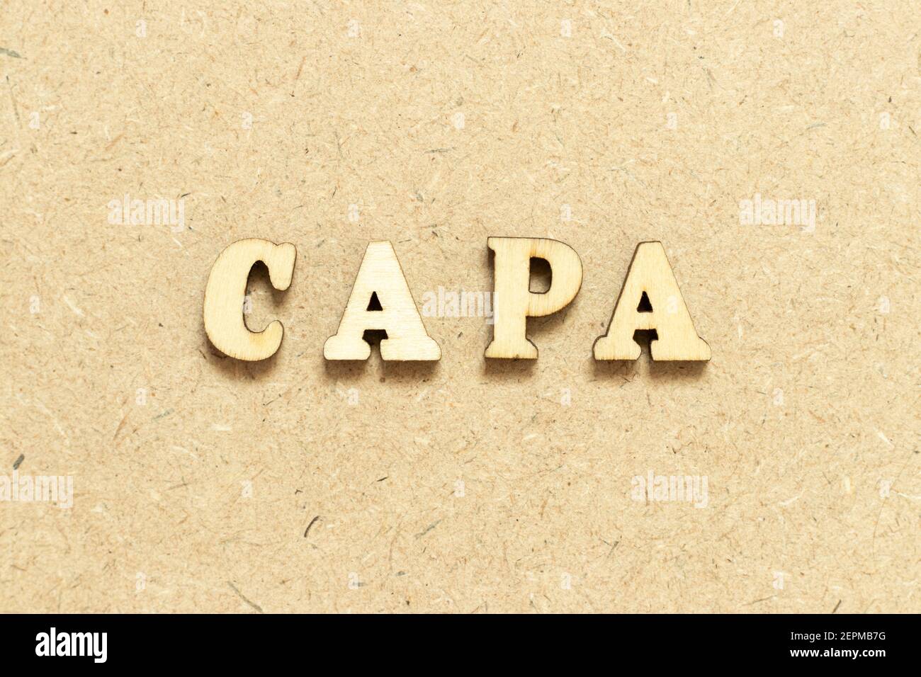Alphabet letter in word CAPA (abbreviation of corrective action and preventive action) on wood background Stock Photo