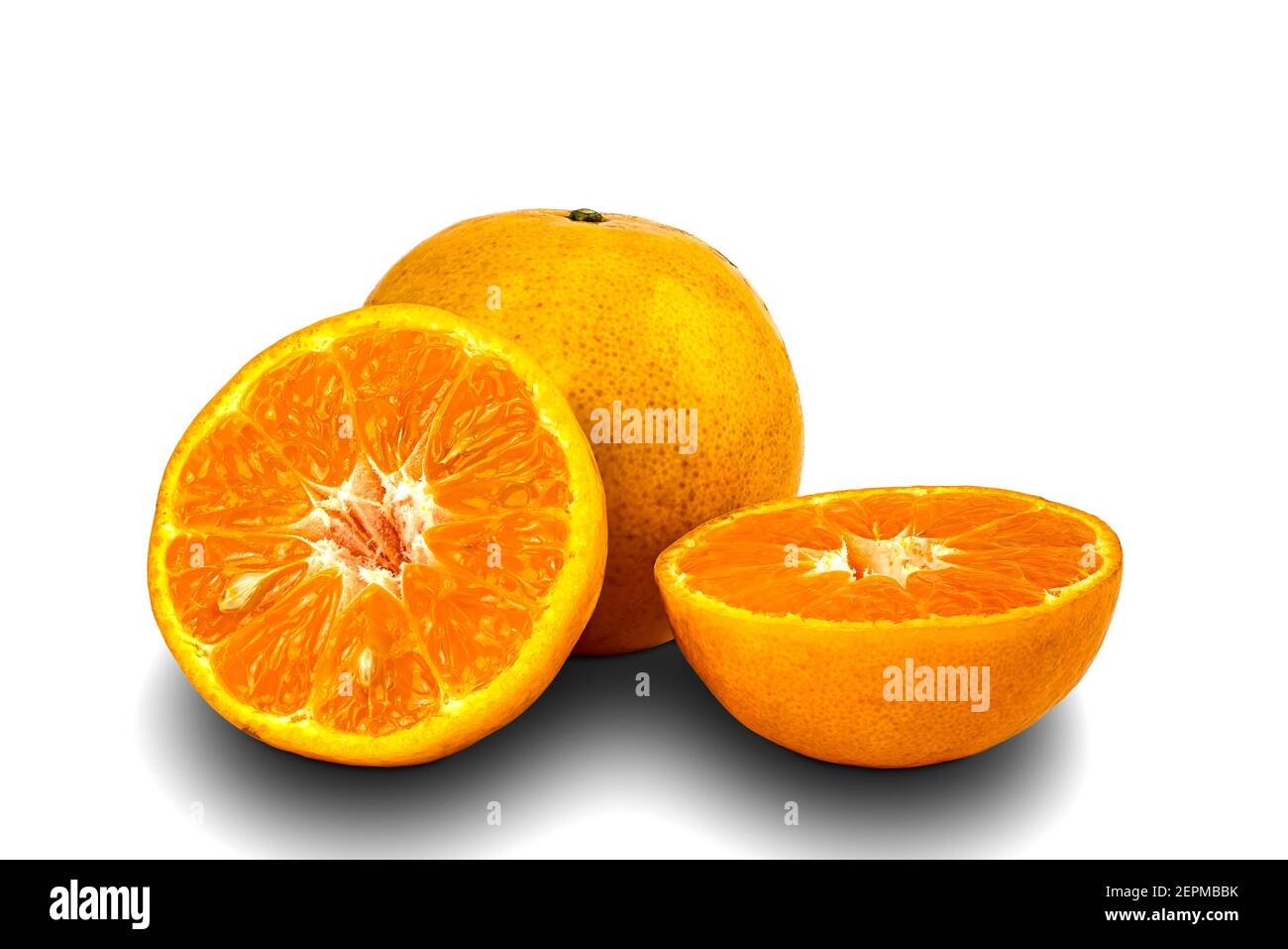 Whole and haves ripe oranges on white background with clipping path. Stock Photo