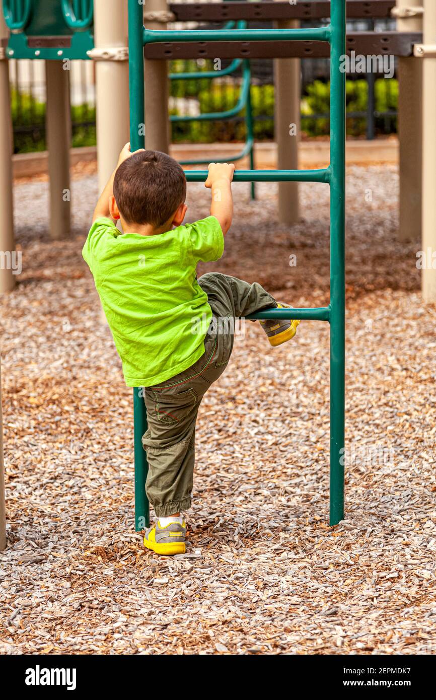 Boy climbing up ladder hires stock photography and images Alamy