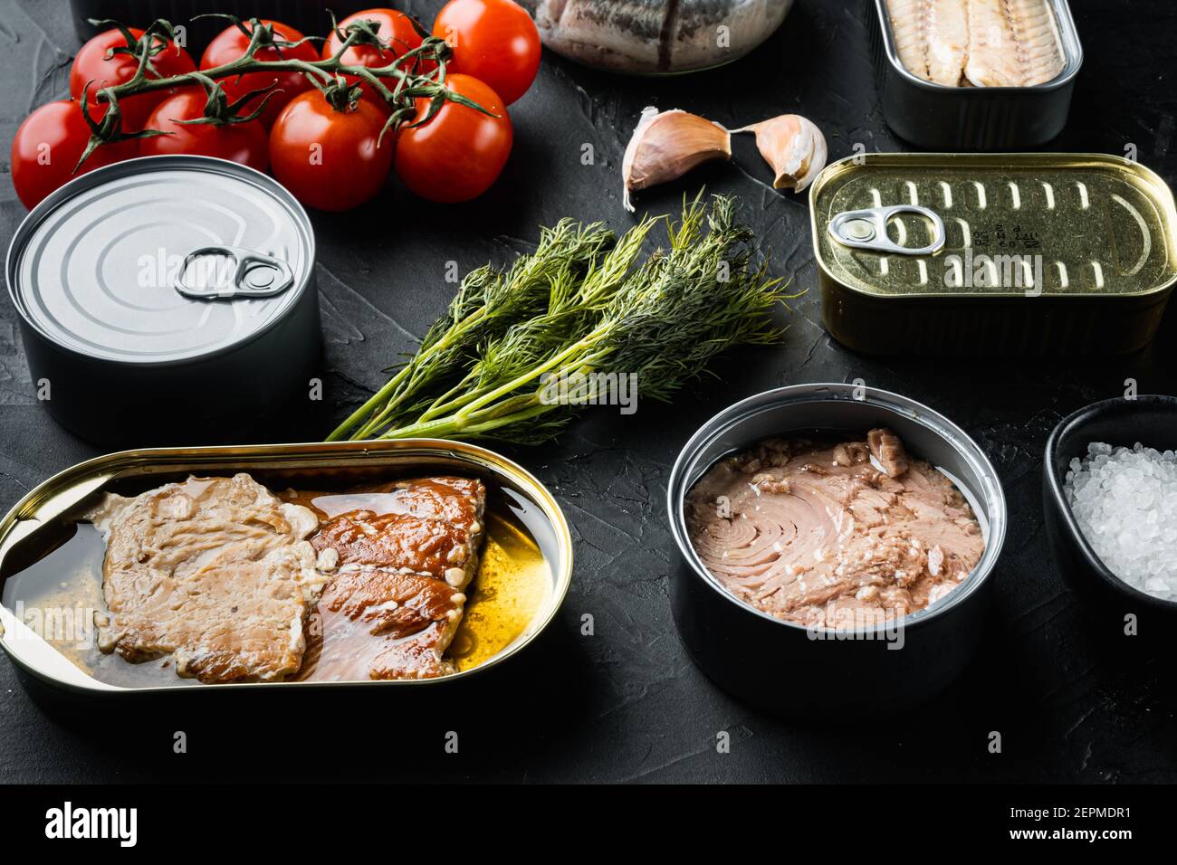 Canned fish with different assortment types of seafood set, on black