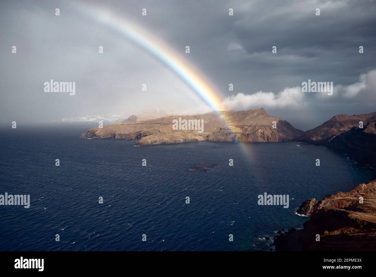 fragment of rainbow above ocean bay of Madeira Island, Portugal Stock Photo