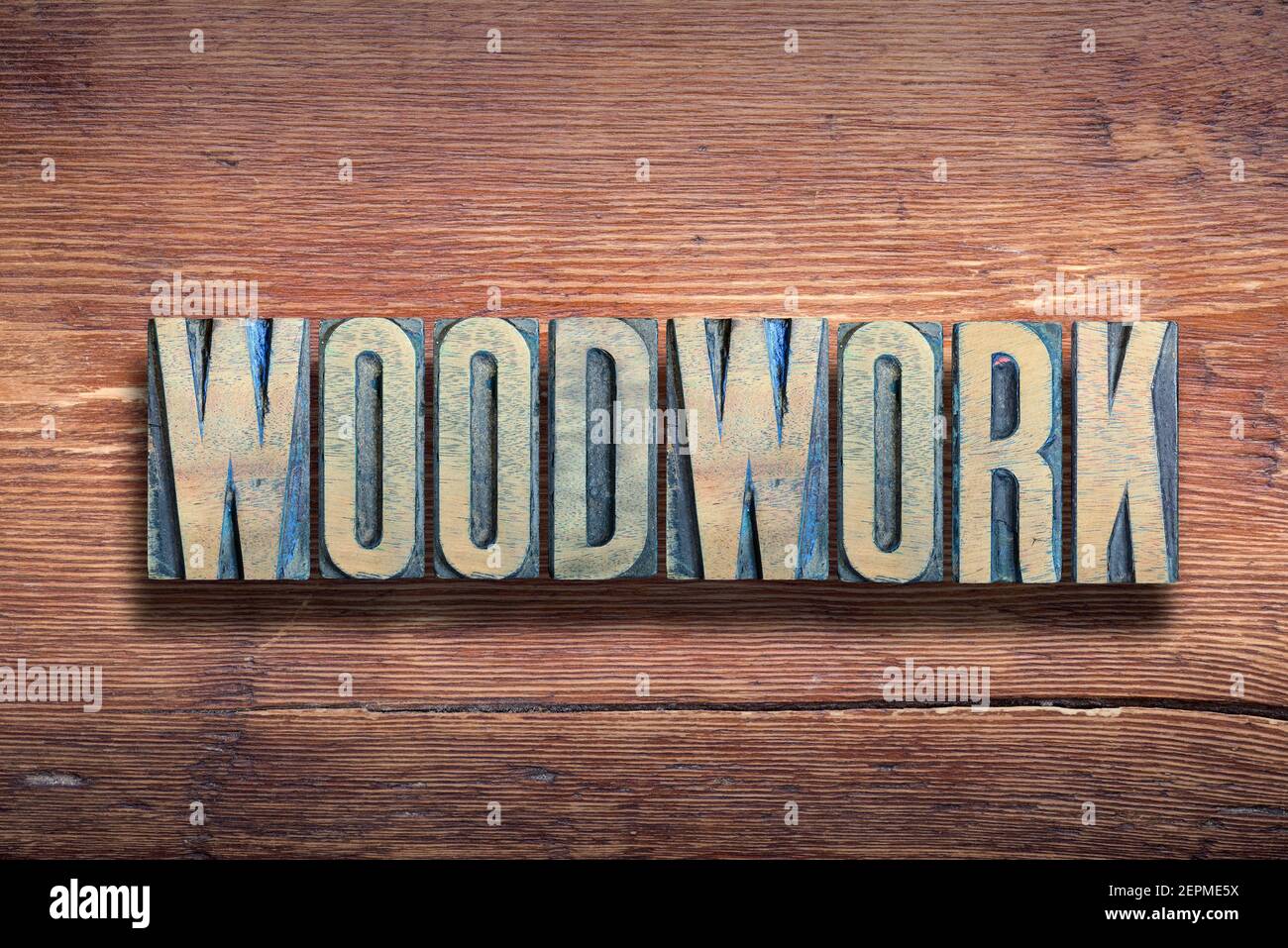woodwork word combined on vintage varnished wooden surface Stock Photo