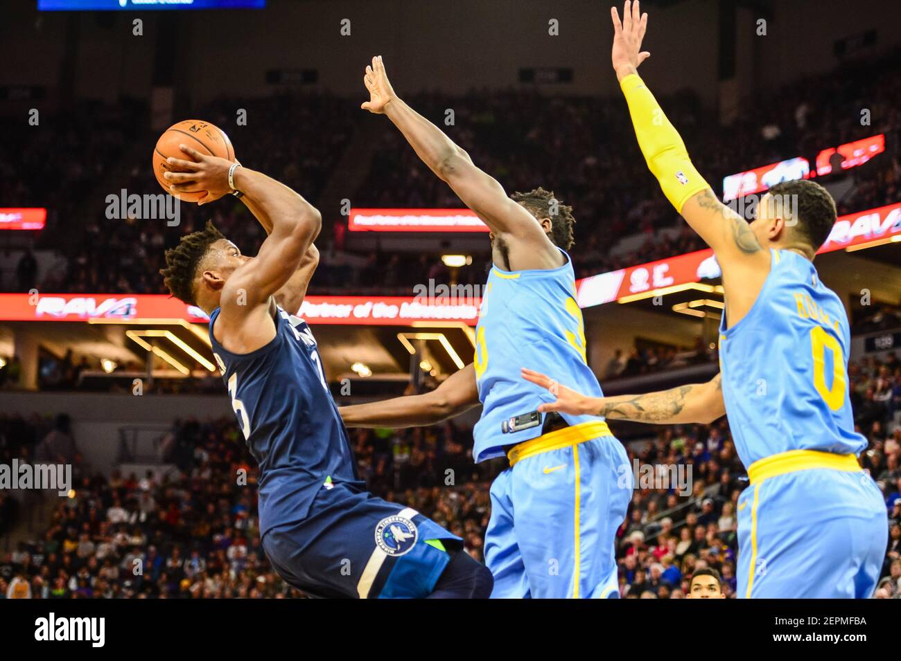 Jan 1, 2018; Minneapolis, MN, USA; Minnesota Timberwolves guard Jimmy Butler (23) shoots the ball over Los Angeles Lakers forward Julius Randle (30) and forward Kyle Kuzma (0) during the second half at Target Center. The Timberwolves won 114-96. Mandatory Credit: Jeffrey Becker-USA TODAY Sports Stock Photo