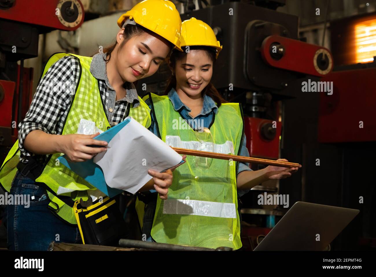 Factory job workers working and discussing manufacturing plan in the factory . Industry and engineering concept . Stock Photo