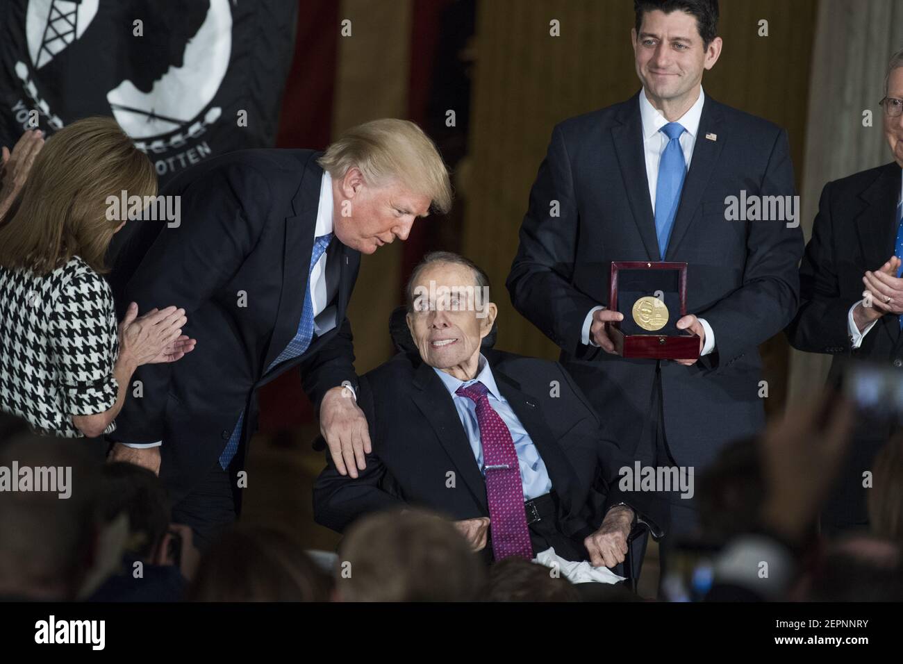 UNITED STATES - JANUARY 17: President Donald Trump, congratulates Sen. Bob Dole, R-Kan., seated, as Speaker Paul Ryan, R-Wis., presents a Congressional Gold Medal to Dole in the Capitol rotunda to honor him as a "soldier, legislator, and statesman," on January 17, 2018. (Photo By Tom Williams/CQ Roll Call) Stock Photo