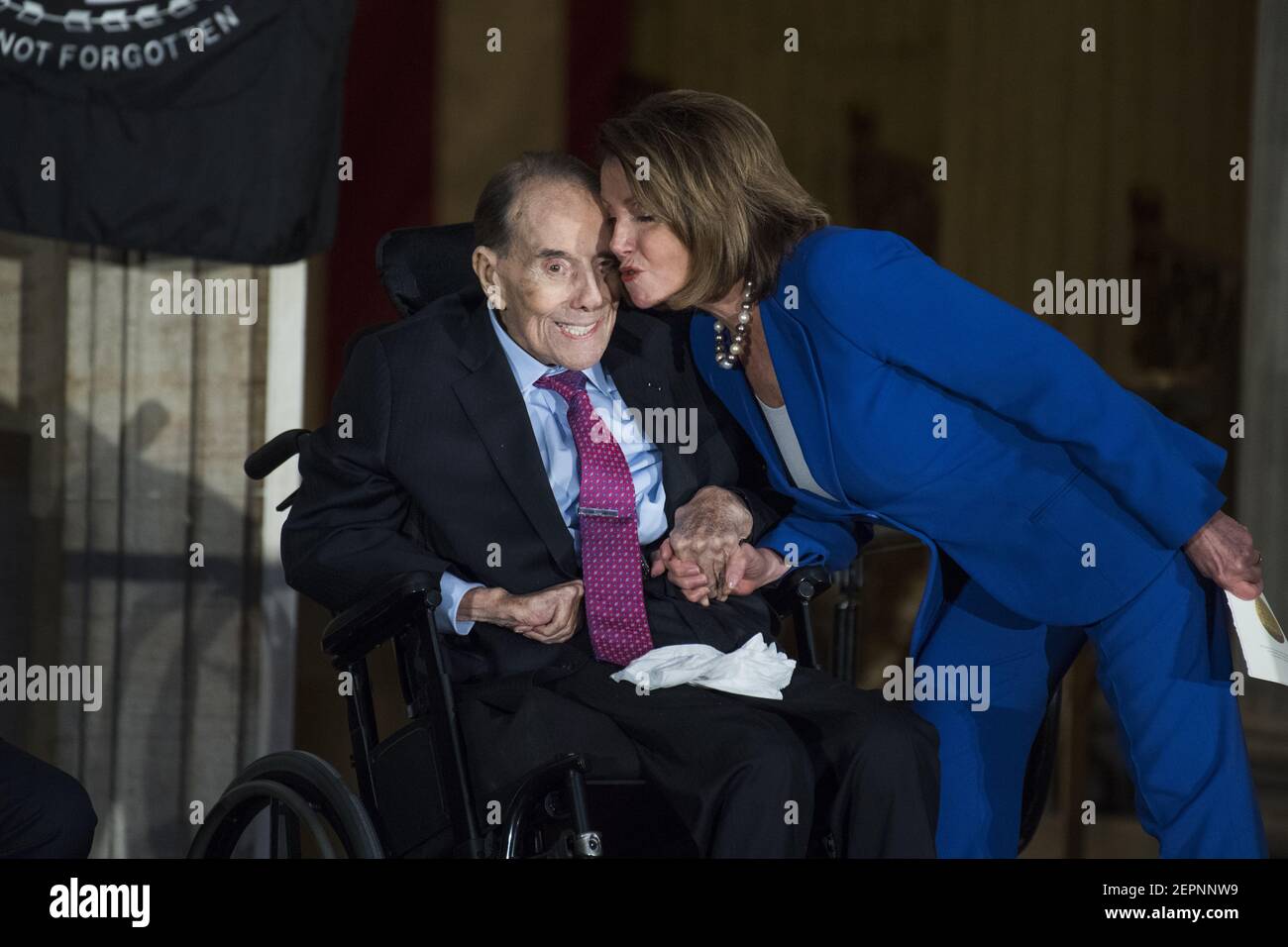 UNITED STATES - JANUARY 17: House Minority Leader Nancy Pelosi, D-Calif., greets former Sen. Bob Dole, R-Kan., during a Congressional Gold Medal ceremony in the Capitol rotunda to honor Dole as a "soldier, legislator, and statesman," on January 17, 2018. (Photo By Tom Williams/CQ Roll Call) Stock Photo