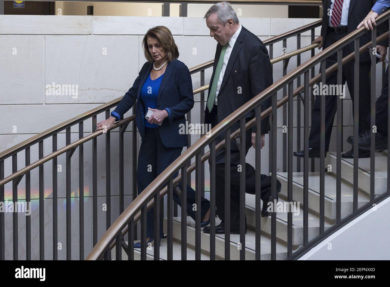 United States House Minority Leader Nancy Pelosi (Democrat of California) and US Senator Dick Durbin (Democrat of Illinois) walk to a Democratic Caucus meeting at the United States Capitol Building in Washington, D.C. on January 19th, 2018. (Photo by Alex Edelman/CNP/Sipa USA) Stock Photo