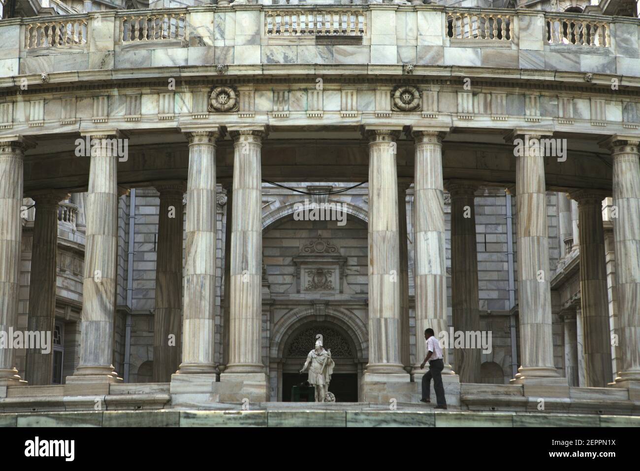 A man visitor stepping toward a statue of Lord Charles (Charles Cornwallis, a British Army general and official) at the Victoria Memorial Hall in Kolkata, West Bengal, India. Stock Photo