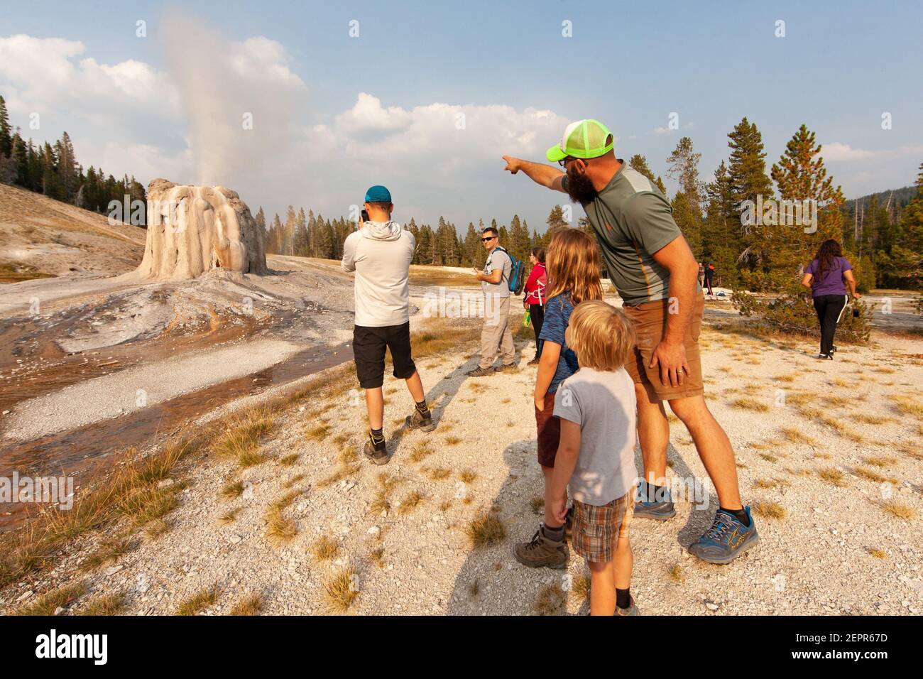 Visitors to Yellowstone National Park enjoying Lone Star Geyser 18/07/04. Stock Photo