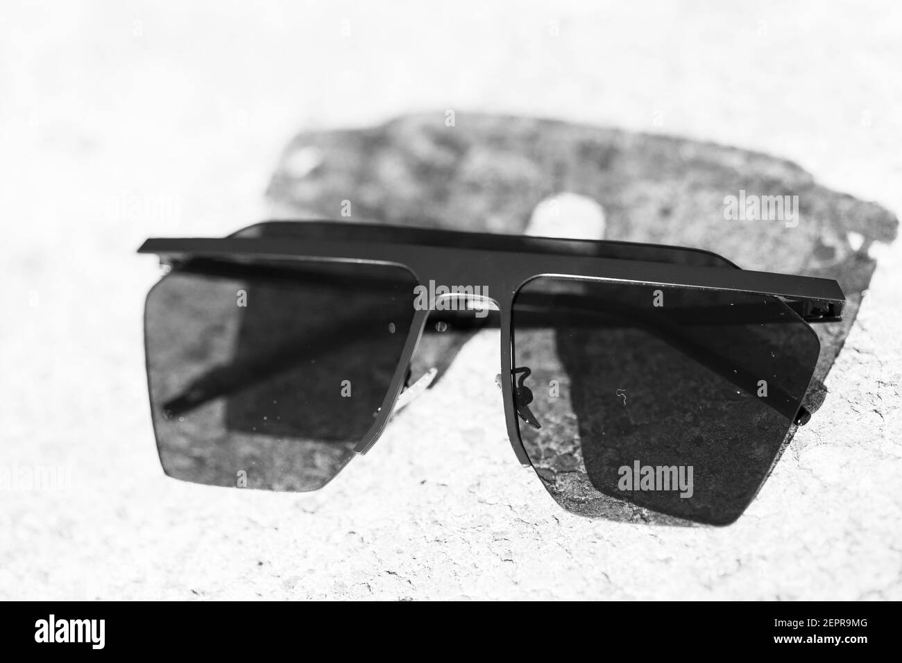 Black Oversized sunglasses shoot in a summer day closeup. Selective focus Stock Photo