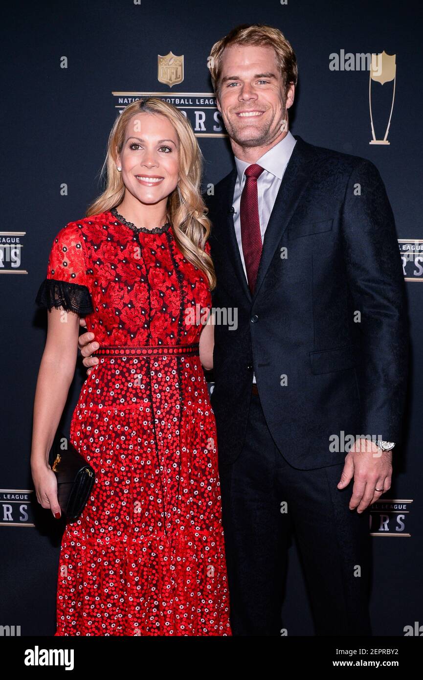 Kara Dooley and Greg Olsen walking on the red carpet the NFL Honors