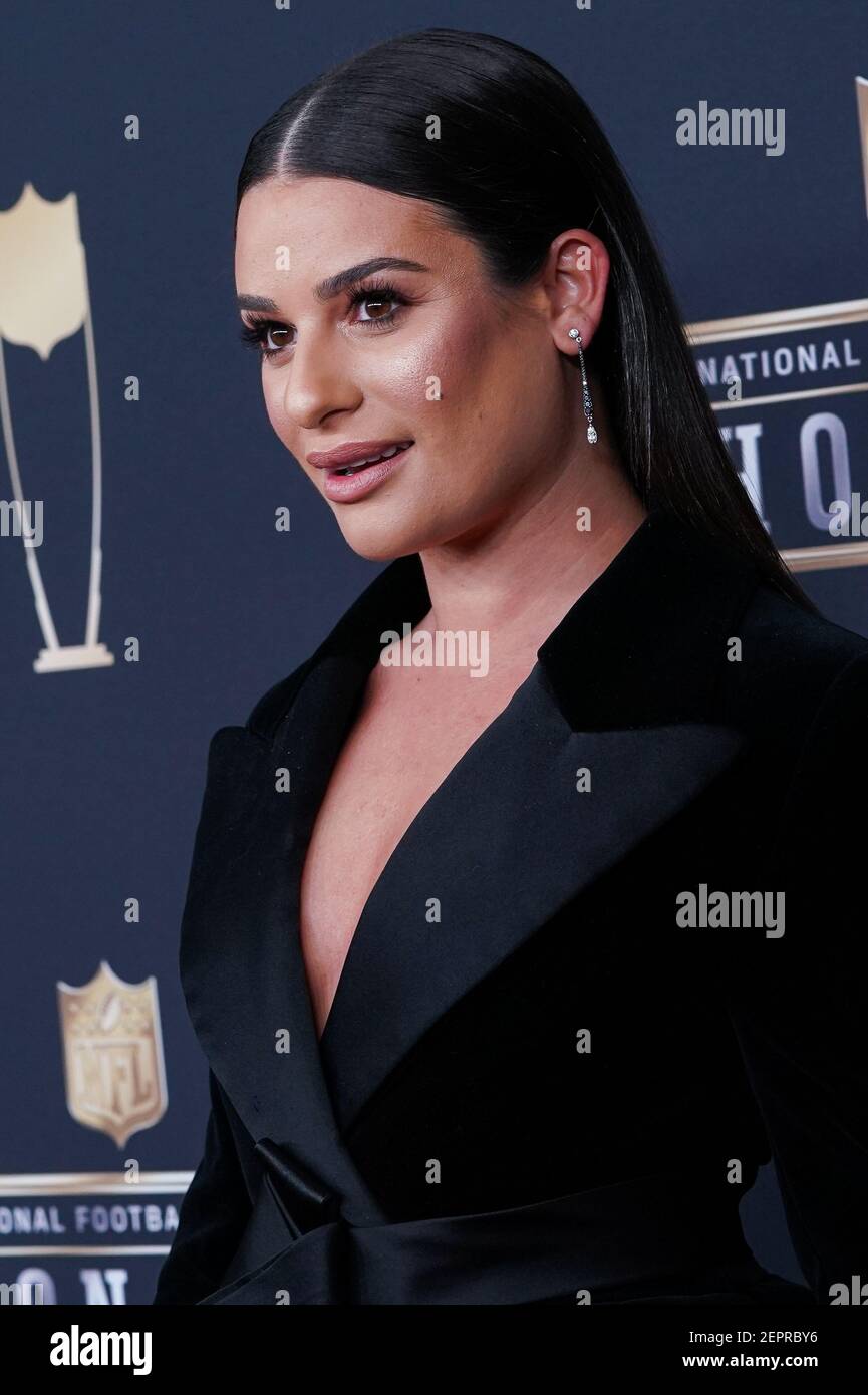 Lea Michele walking on the red carpet the NFL Honors held at the Cyrus