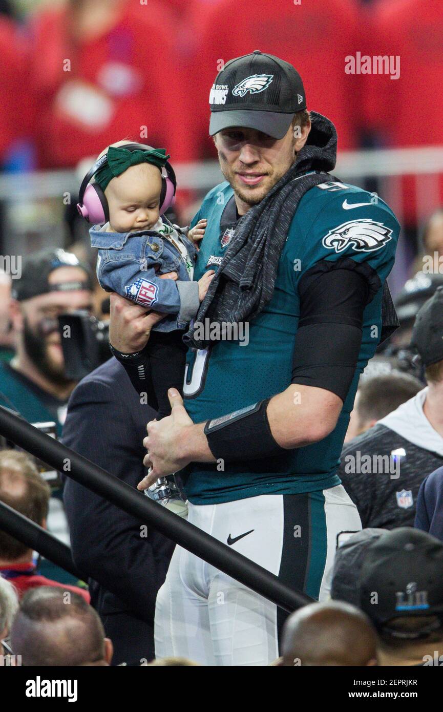 Philadelphia Eagles quarterback Nick Foles (#9) and his daughter Lily James  Foles celebrate with the Vince Lombardi trophy after defeating the New  England Patriots 41- 33 at Super Bowl LII between the