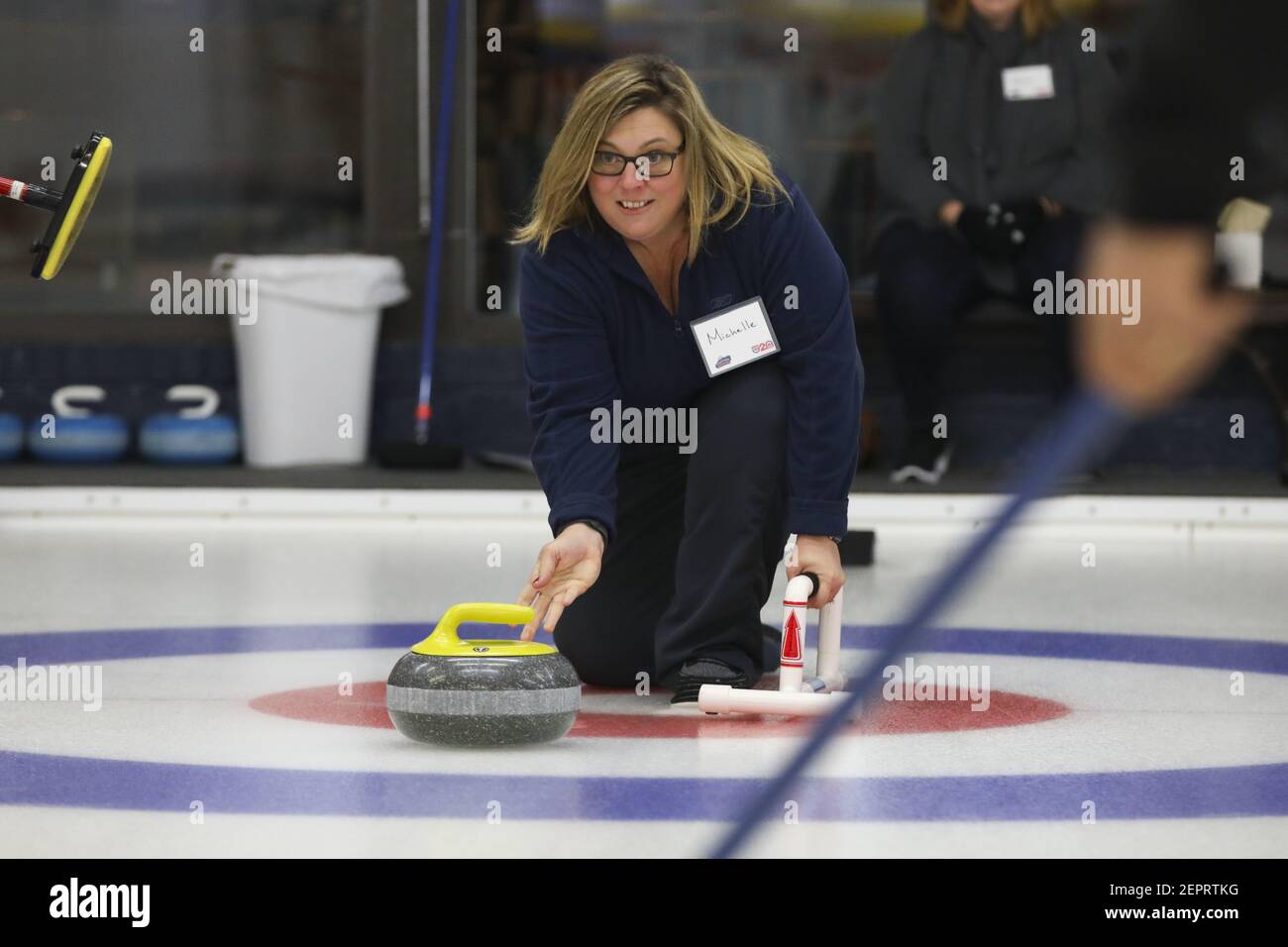 Michelle Landis launches a granite curling rock down the ice during a Learn2Curl class at the Chicago Curling Club on January 10, 2018, in Northbrook, Ill. The Club is celebrating its 70th year. (Photo by Stacey Wescott/Chicago Tribune/TNS/Sipa USA) Stock Photo