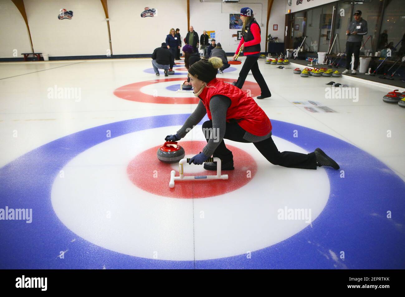 Betsy Barnett launches a granite curling rock during a Learn2Curl class at the Chicago Curling Club on January 10, 2018, in Northbrook, Ill. The Club is celebrating its 70th year. (Photo by Stacey Wescott/Chicago Tribune/TNS/Sipa USA) Stock Photo