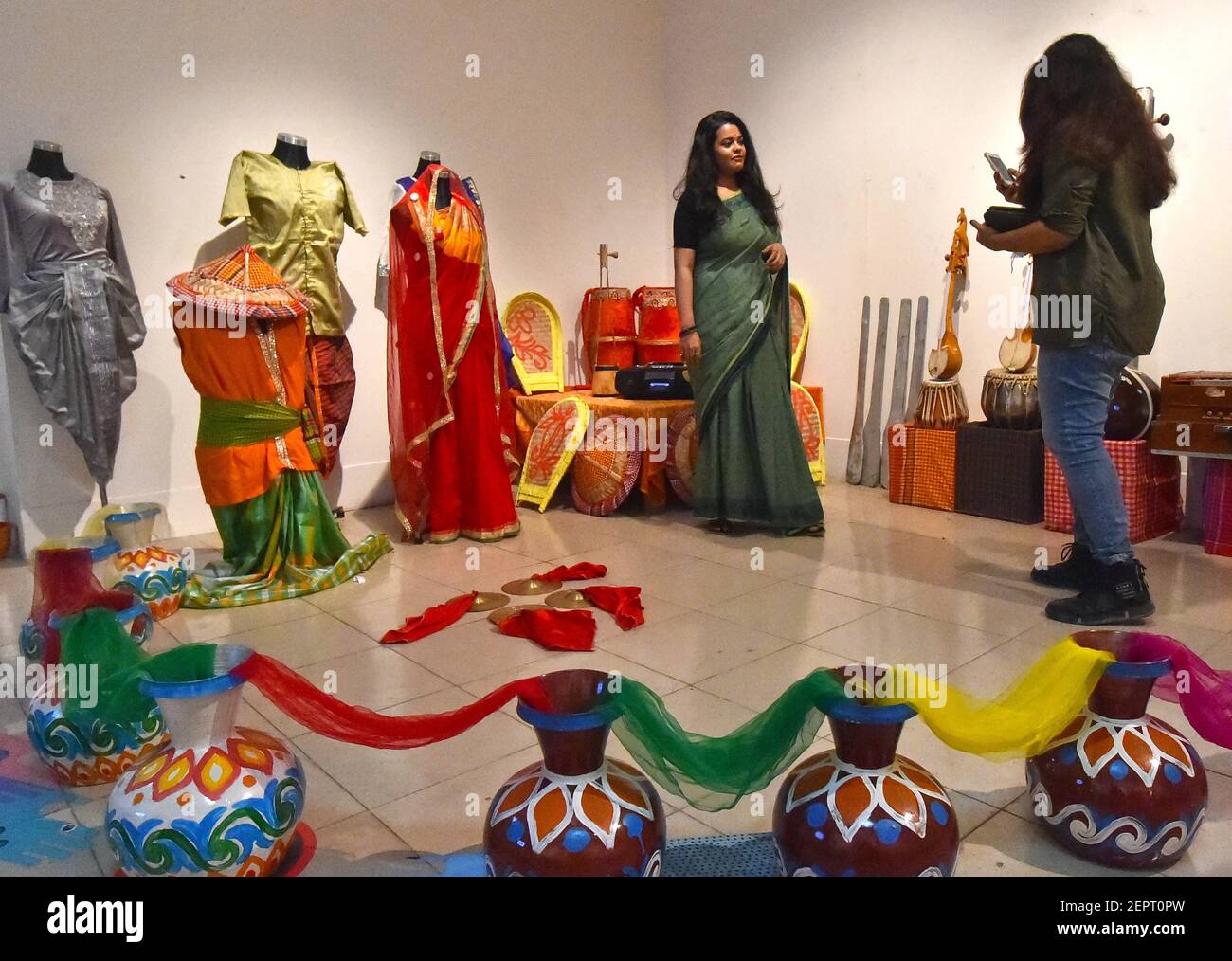 Dhaka. 28th Feb, 2021. A visitor poses for photos during an exhibition