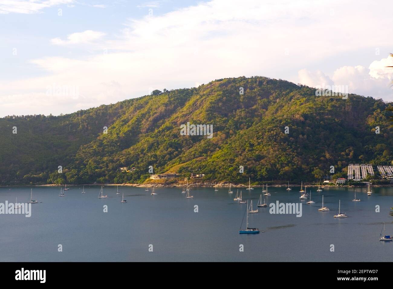 Yachts with lowered sails are in the bay. Thailand. Stock Photo