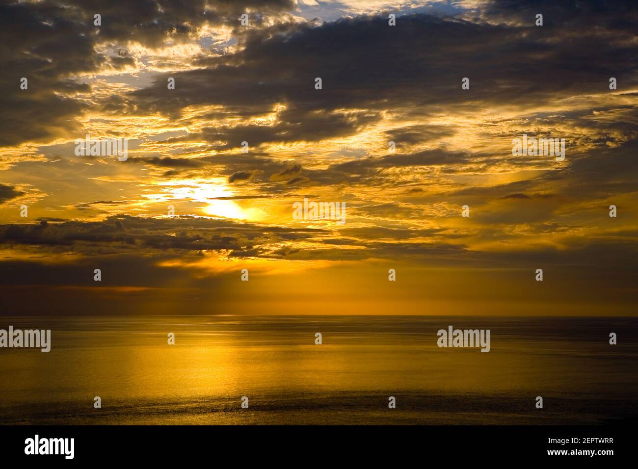 Colorful golden sunset and cloudy sky at the sea. Nature. Stock Photo