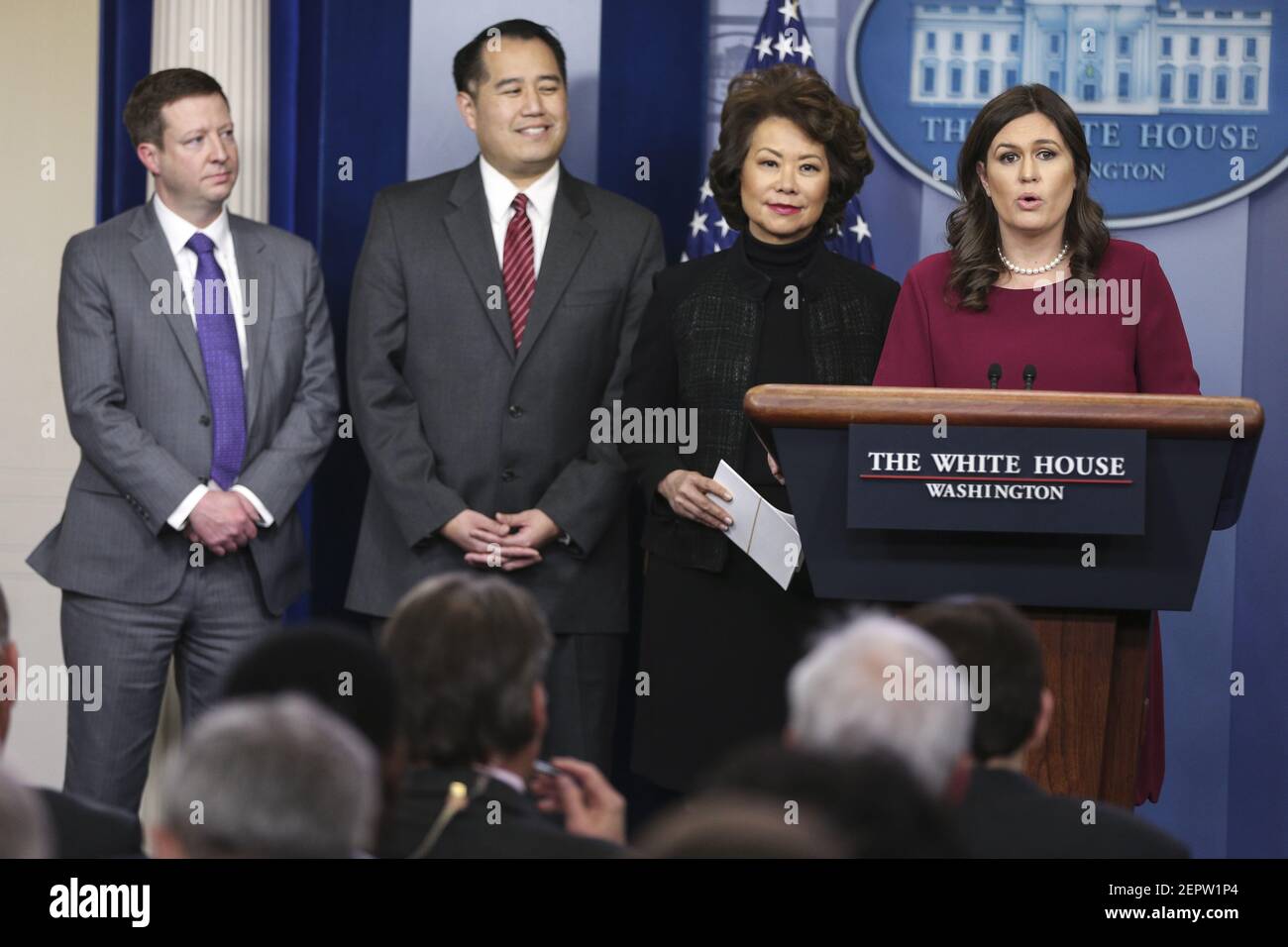 transportation-secretary-elaine-chao-center-right-and-under-secretary-for-policy-derek-kan-center-left-presented-a-100-000-check-by-white-house-press-secretary-sarah-sanders-from-president-donald-trump-s-quarterly-salary