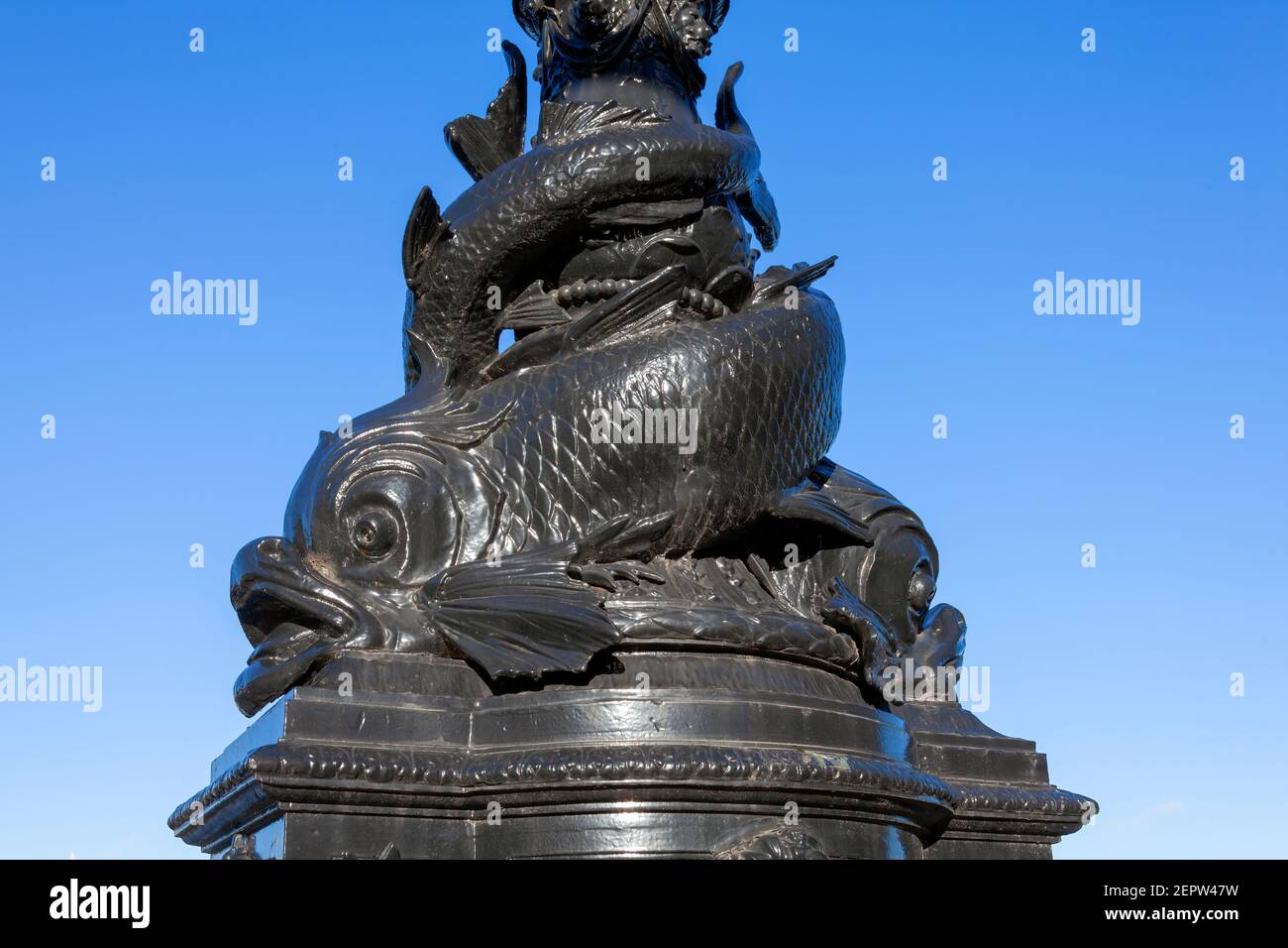 Dolphin lamp standard sculpture statue street furniture lampost on the Embankment of the River Thames which were erected in 1870 and are a popular tou Stock Photo
