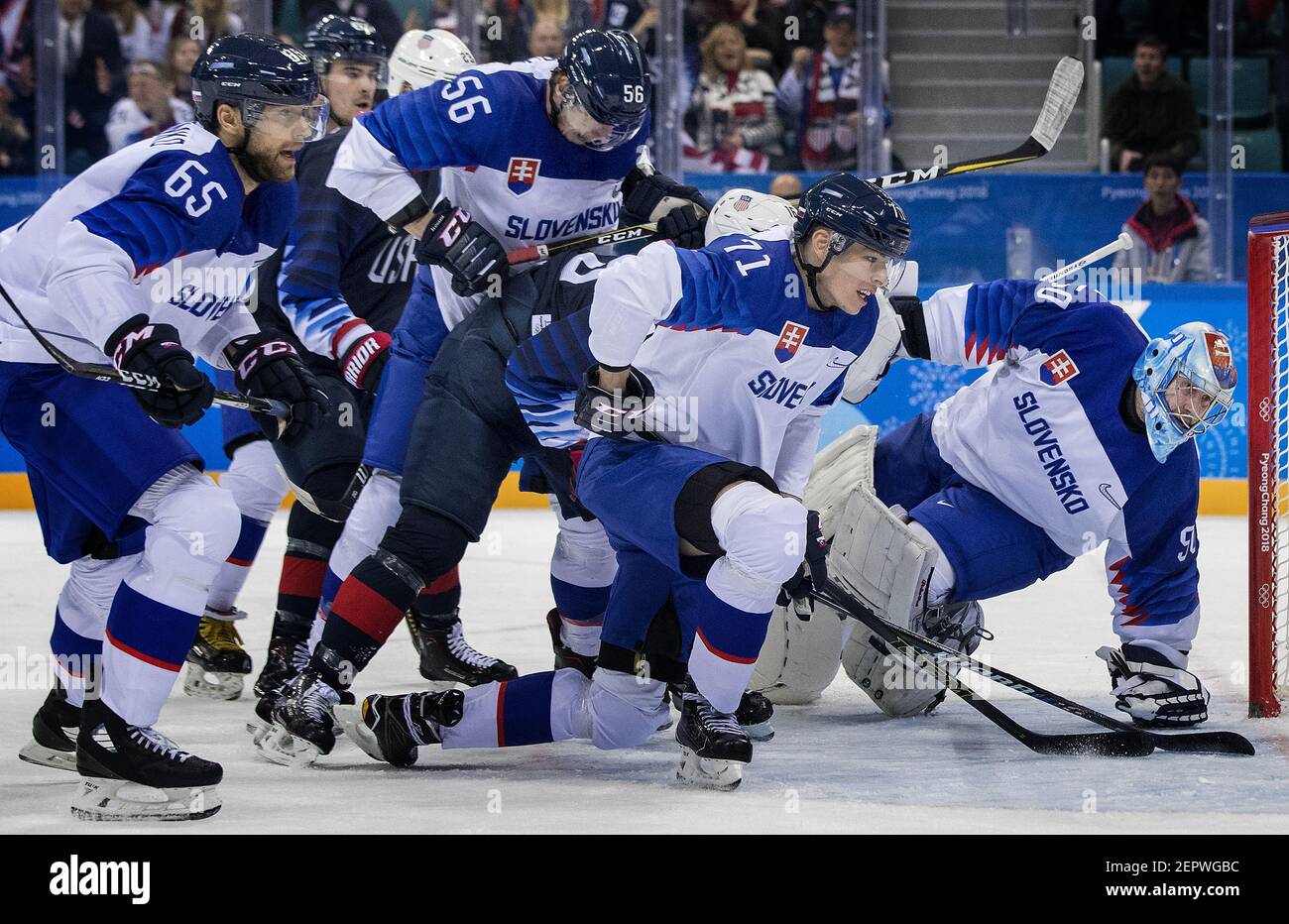 USA and Slovakia players chase the puck past Slovakia goalie Jan Laco (50) in the first period during group play on Friday, Feb. 16, 2018, at South Korea's Gangneung Hockey Centre in the Pyeongchang Winter Olympics. (Photo by Carlos Gonzalez/Minneapolis Star Tribune/TNS/Sipa USA) Stock Photo