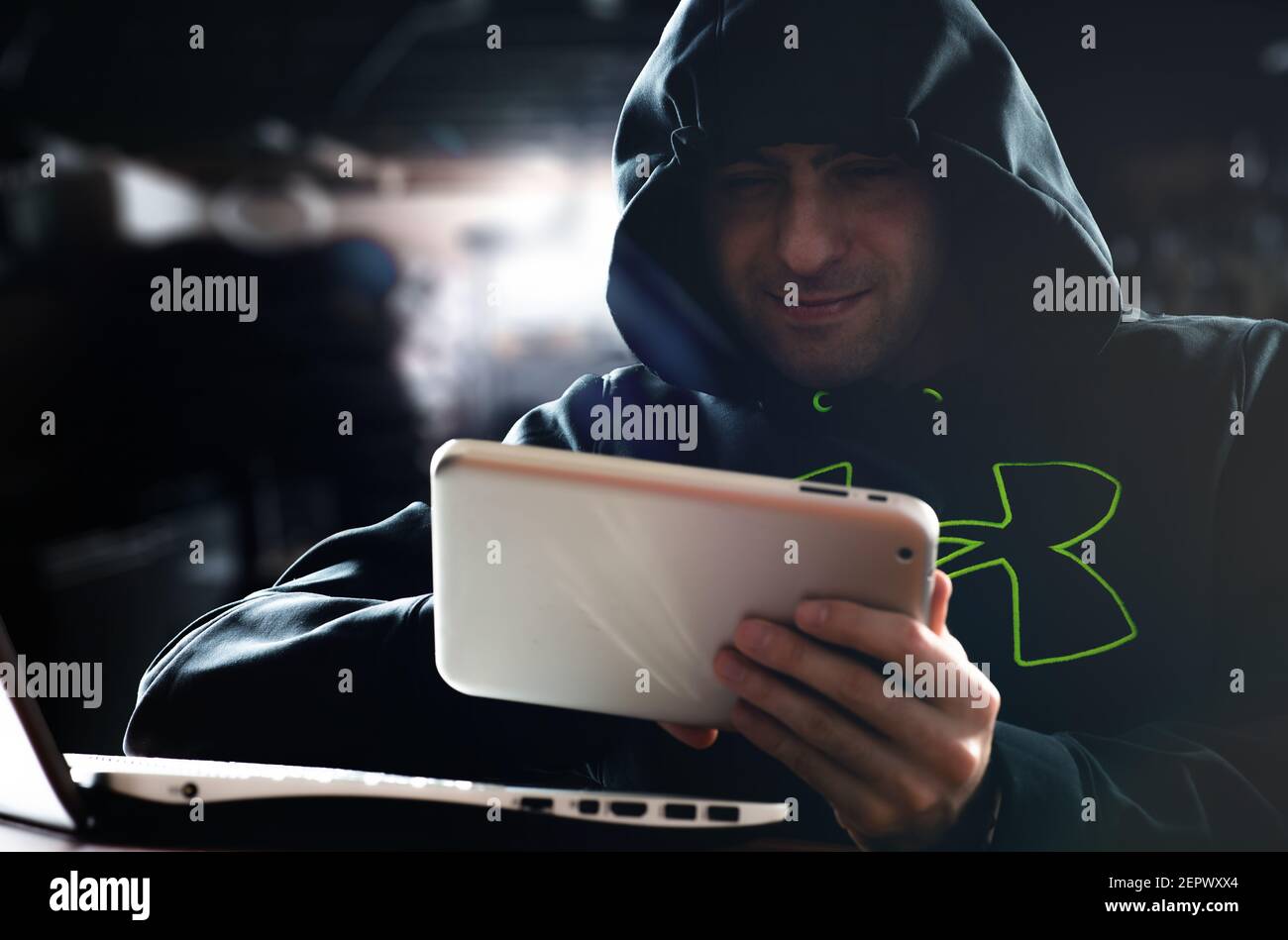 Hacker hacking a digital tablet Stock Photo Alamy