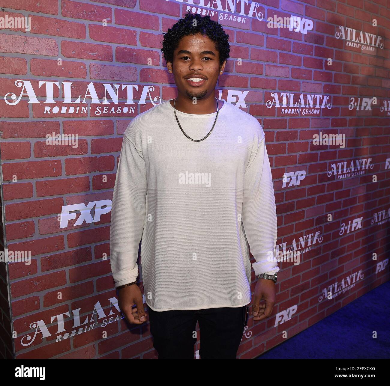 LOS ANGELES - FEBRUARY 19: Isaiah John arrives at the red carpet event