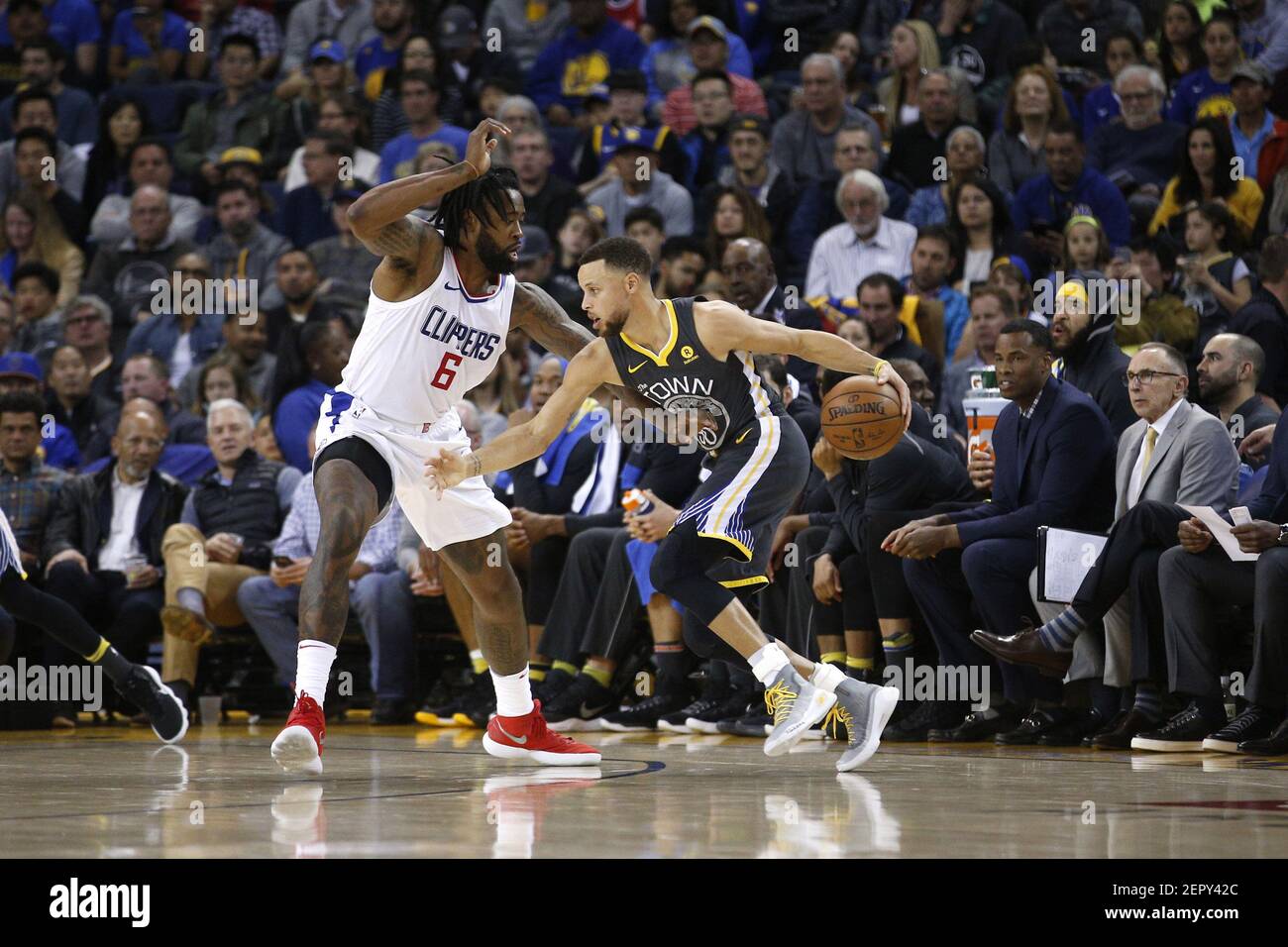 Feb 22, 2018; Oakland, CA, USA; Golden State Warriors guard Stephen Curry  (30) dribbles against Los Angeles Clippers center DeAndre Jordan (6) in the  second quarter at Oracle Arena. Mandatory Credit: Cary
