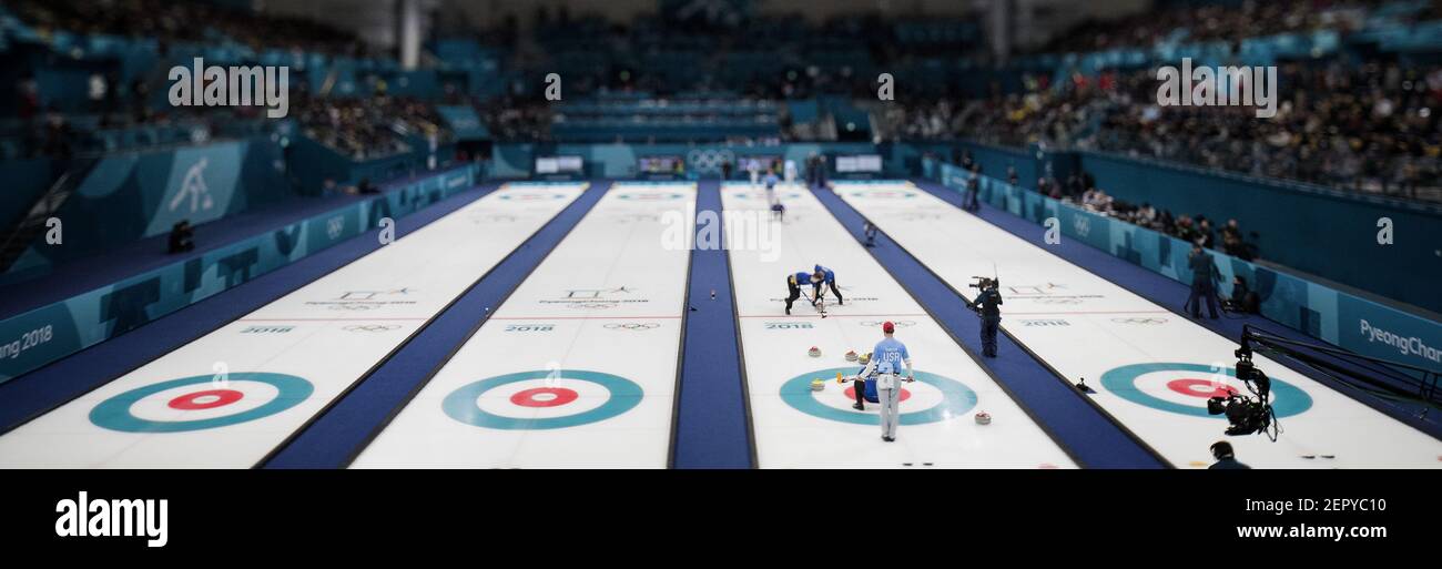 Team Sweden sweeps in front of the rock against Team USA during the gold-medal match on Saturday, Feb. 24, 2018, at the Pyeongchang Winter Olympics' Gangneung Curling Centre. Team USA won, 10-7. (Photo by Carlos Gonzalez/Minneapolis Star Tribune/TNS/Sipa USA) Stock Photo