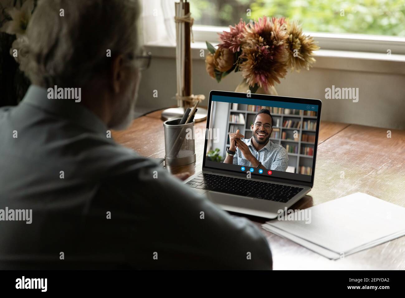 Screen view of happy black young man talking to father Stock Photo