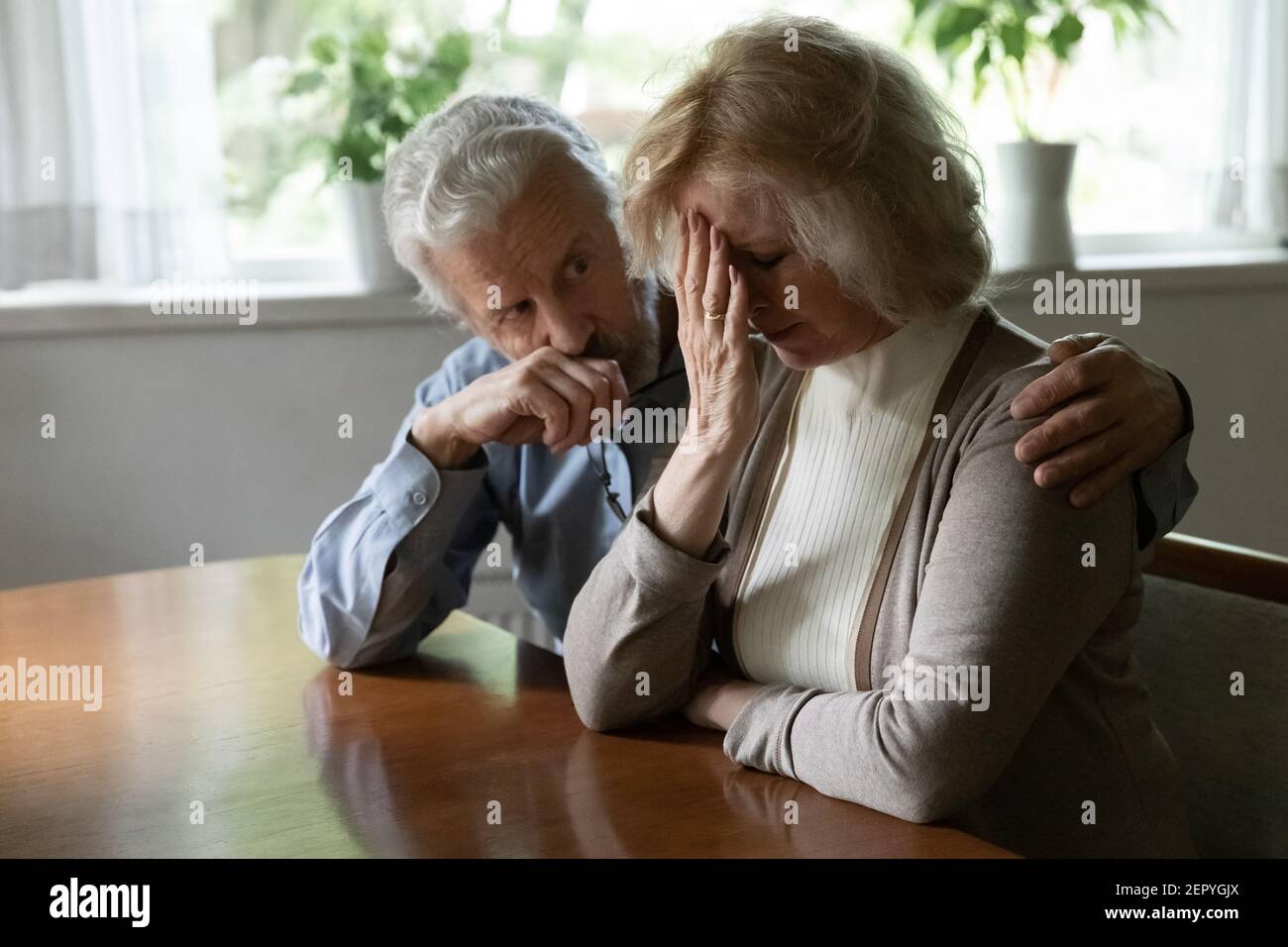 Woman embrace sad man hi-res stock photography and images - Alamy